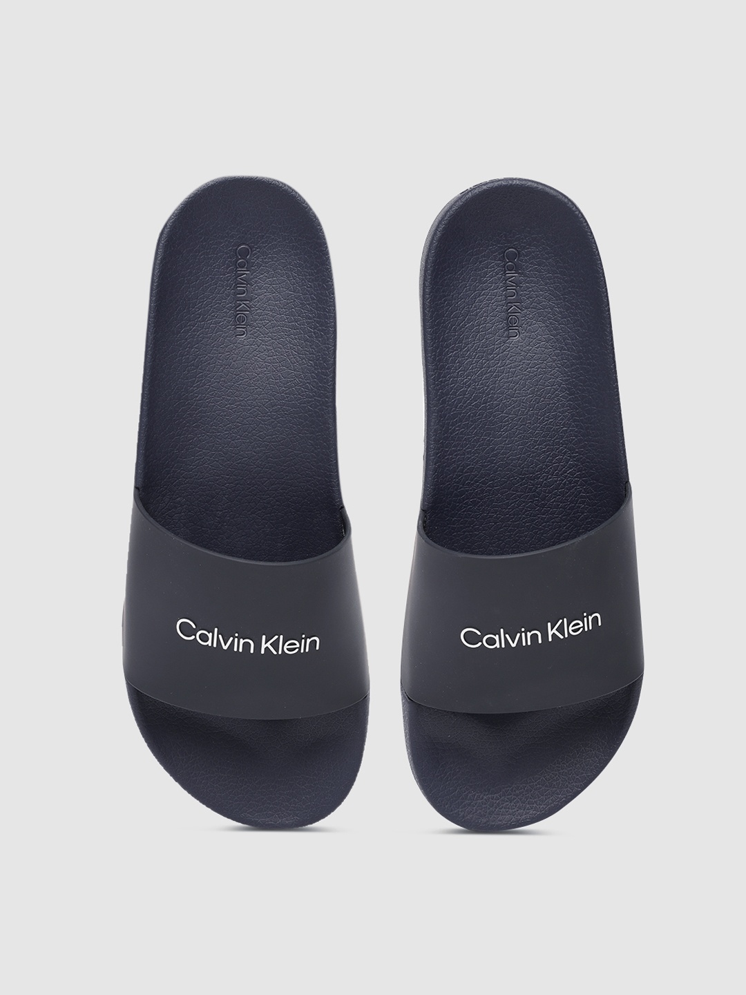 

Calvin Klein Men Navy Blue Printed Sliders
