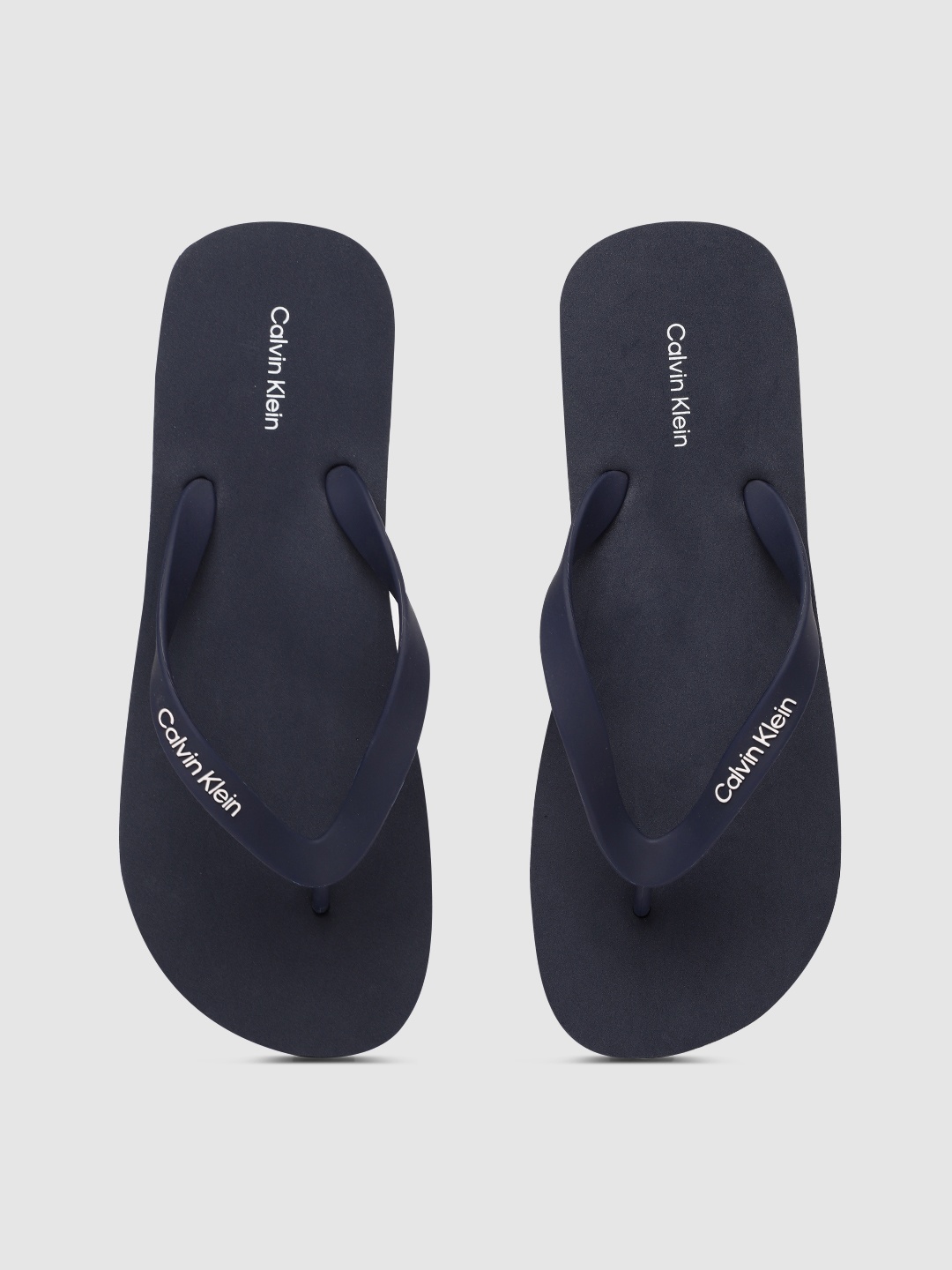 

Calvin Klein Men Navy Blue Printed Thong Flip-Flops