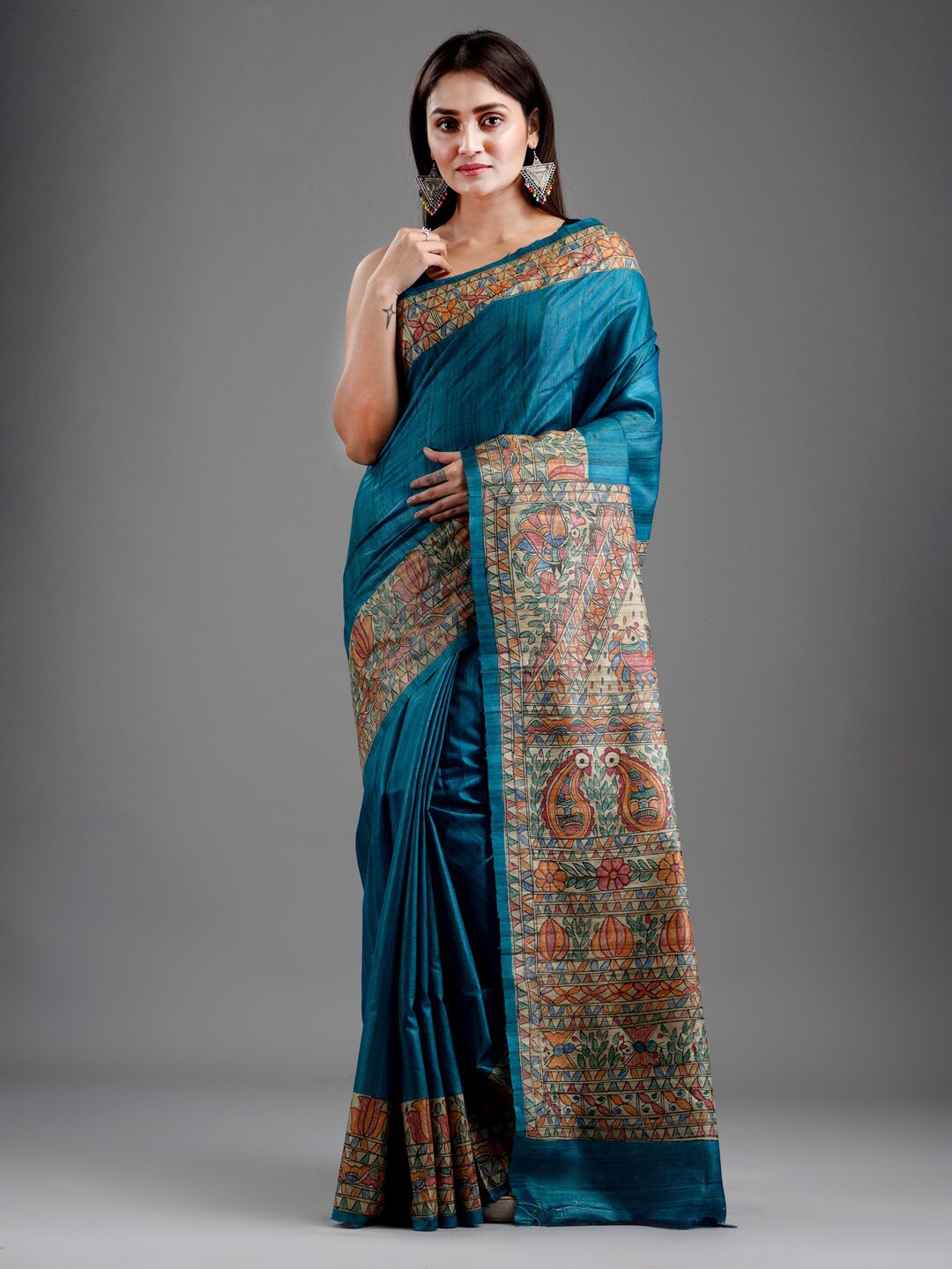 

Mitera Teal & Beige Pure Silk Saree With Madhubani Handpainted Border