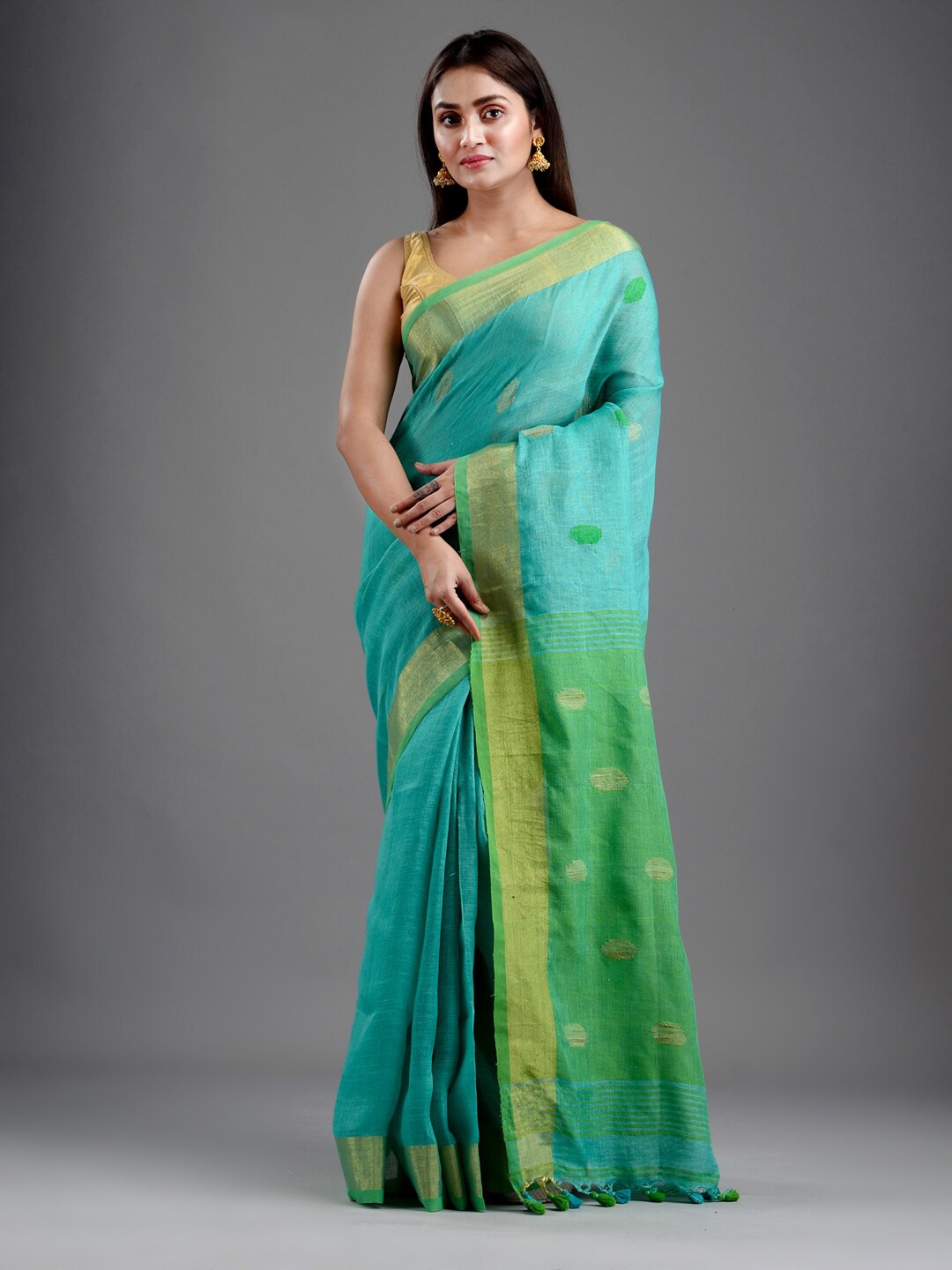 

Mitera Sea Green & Blue Ethnic Motifs Pure Linen Handloom Saree
