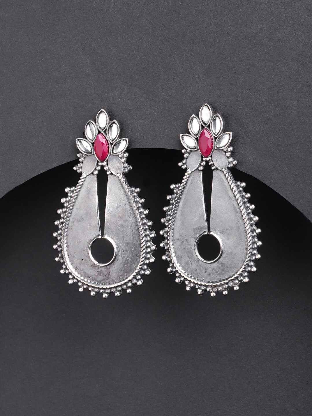 

Priyaasi Silver-Plated Kundan & Ruby Studded Oxidised Teardrop Shaped Earrings