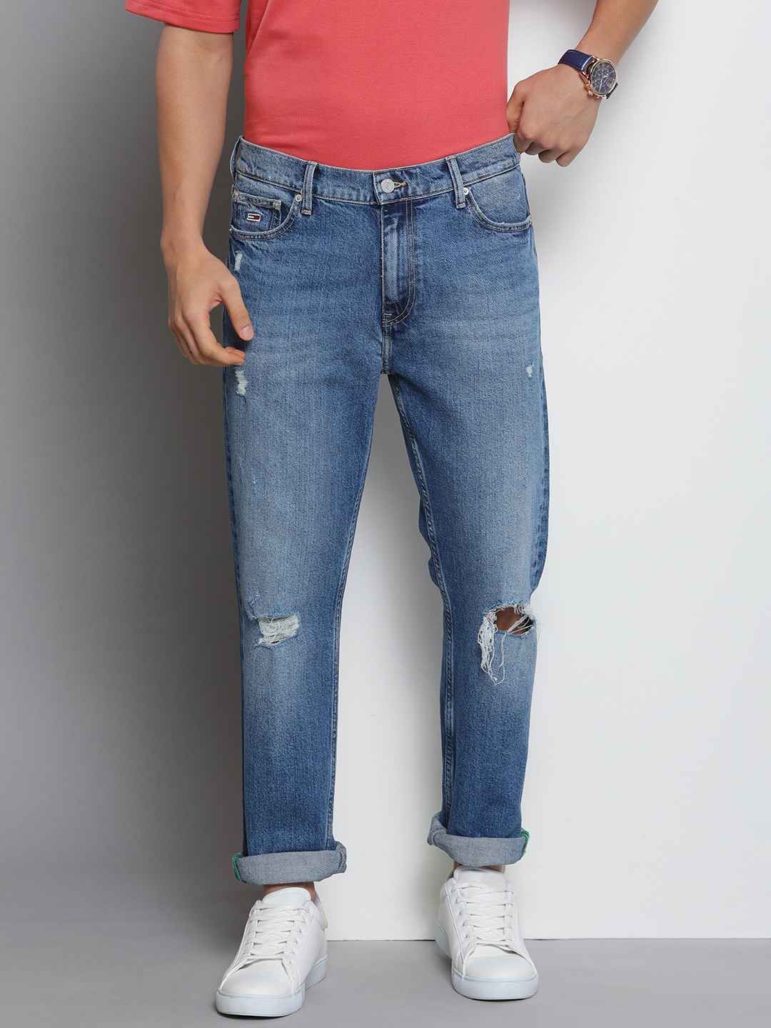 

Tommy Hilfiger Men Tapered Fit Mildly Distressed Light Fade Stretchable Jeans, Blue