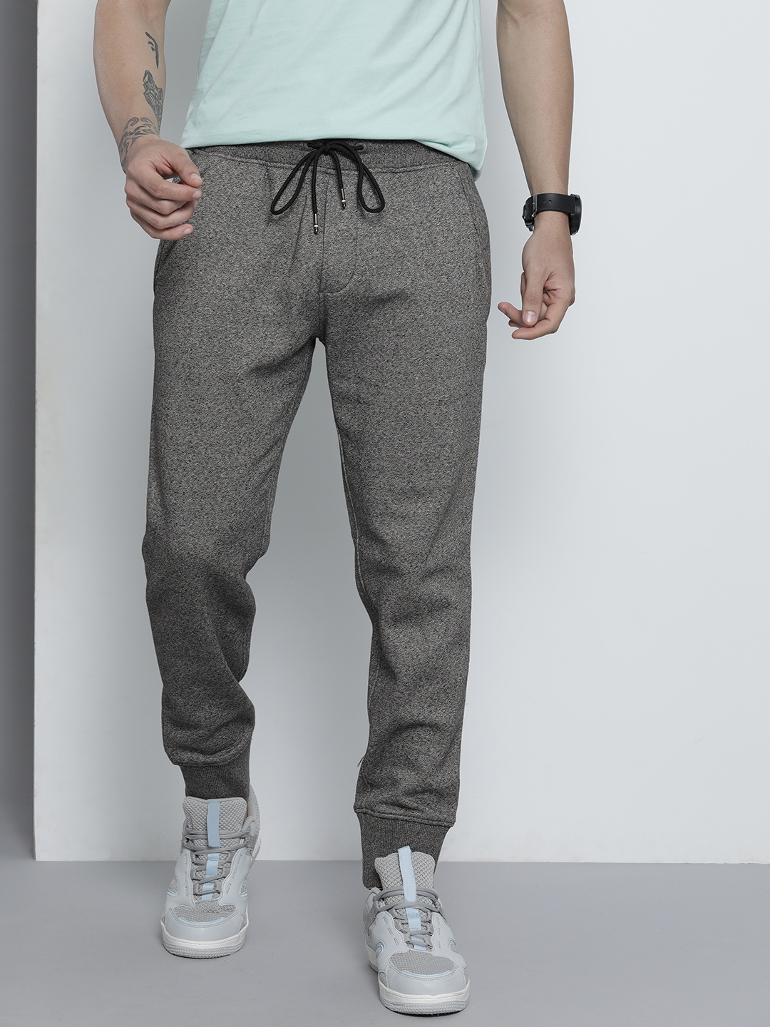 

Tommy Hilfiger Men Grey Melange Solid Mid-Rise Knitted Regular Joggers