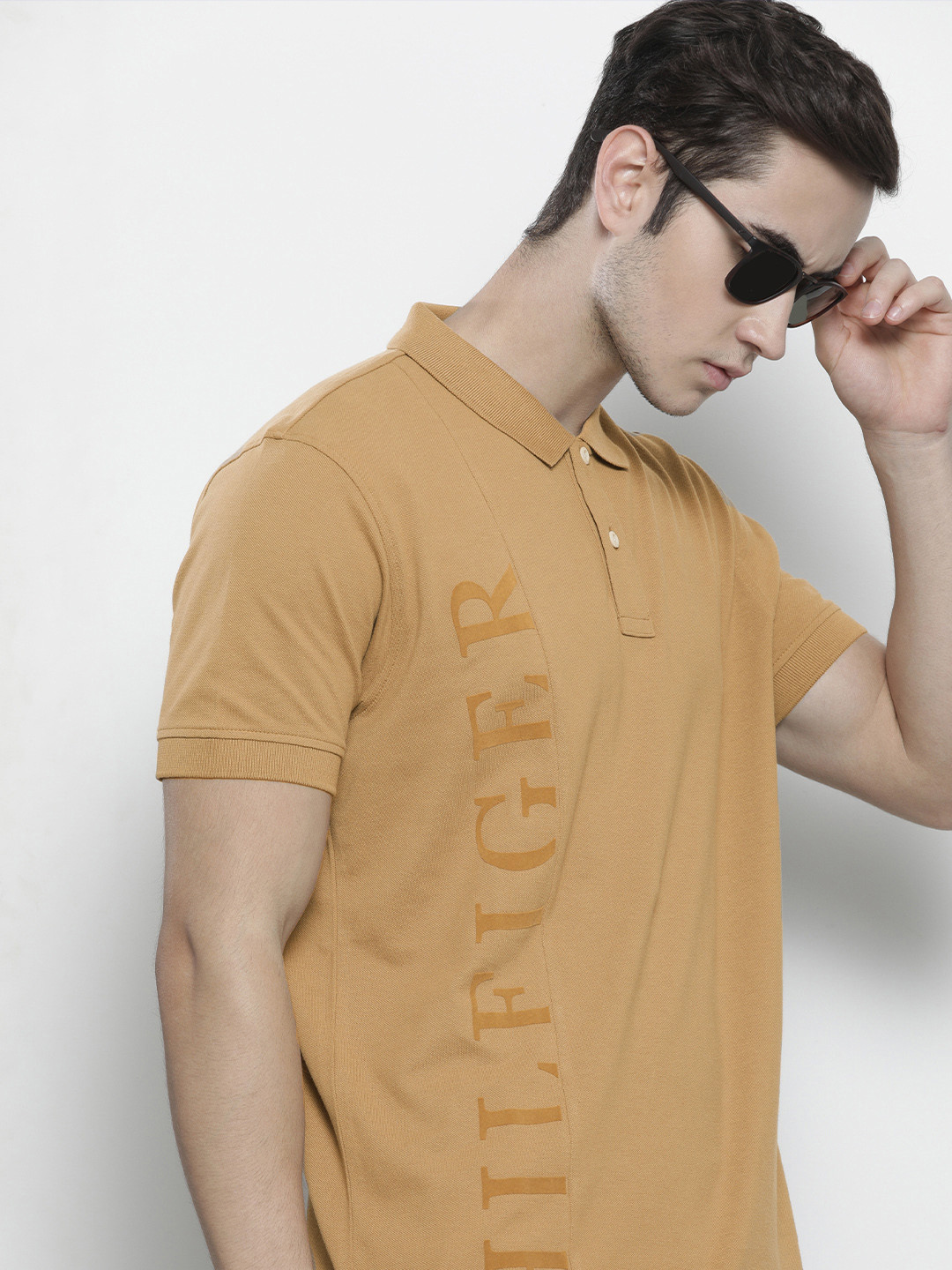 

Tommy Hilfiger Men Brown Brand Logo Printed Polo Collar Organic Cotton T-shirt