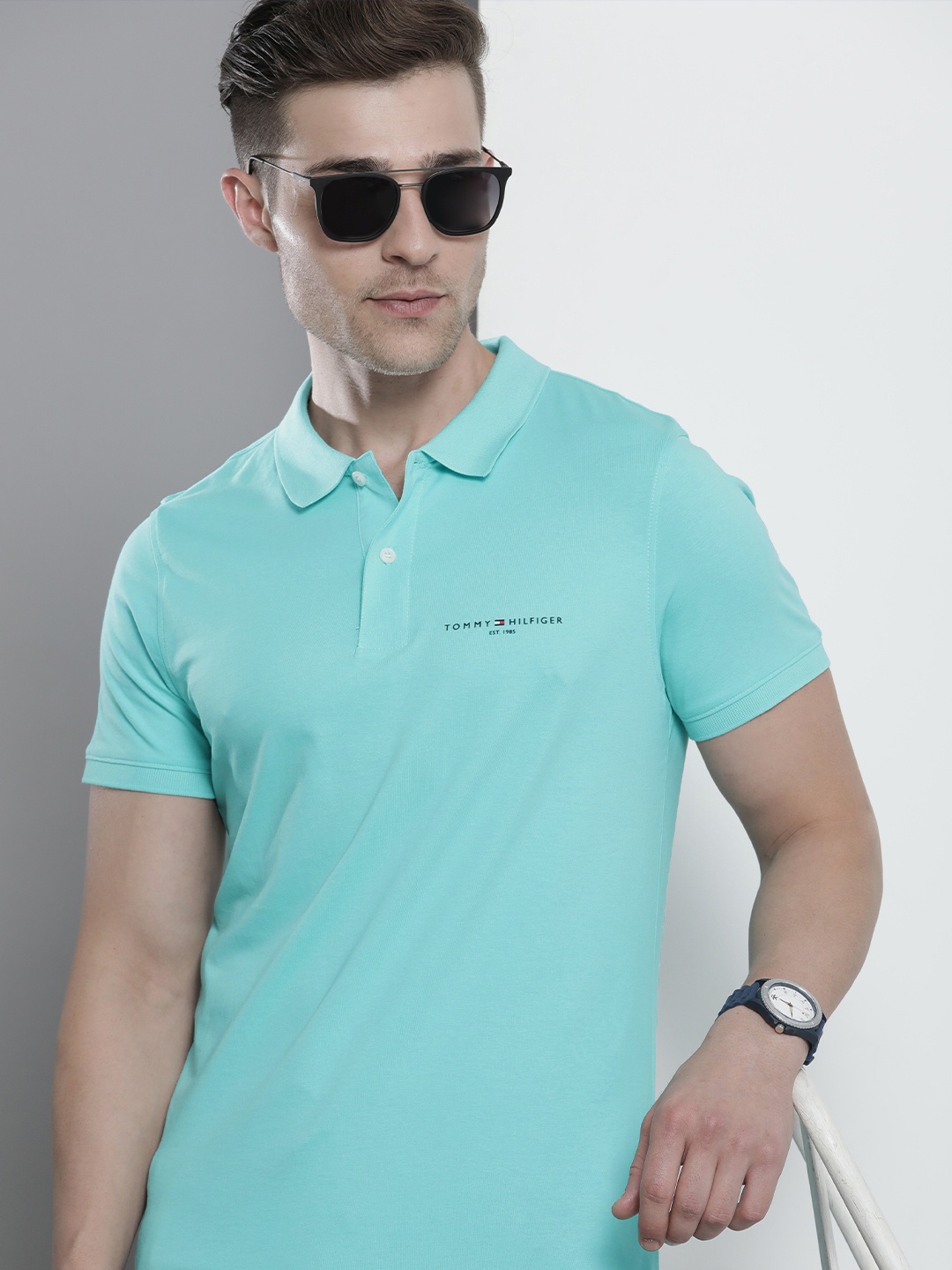 

Tommy Hilfiger Men Blue Brand Logo Printed Pure Cotton Polo Collar Slim Fit T-shirt