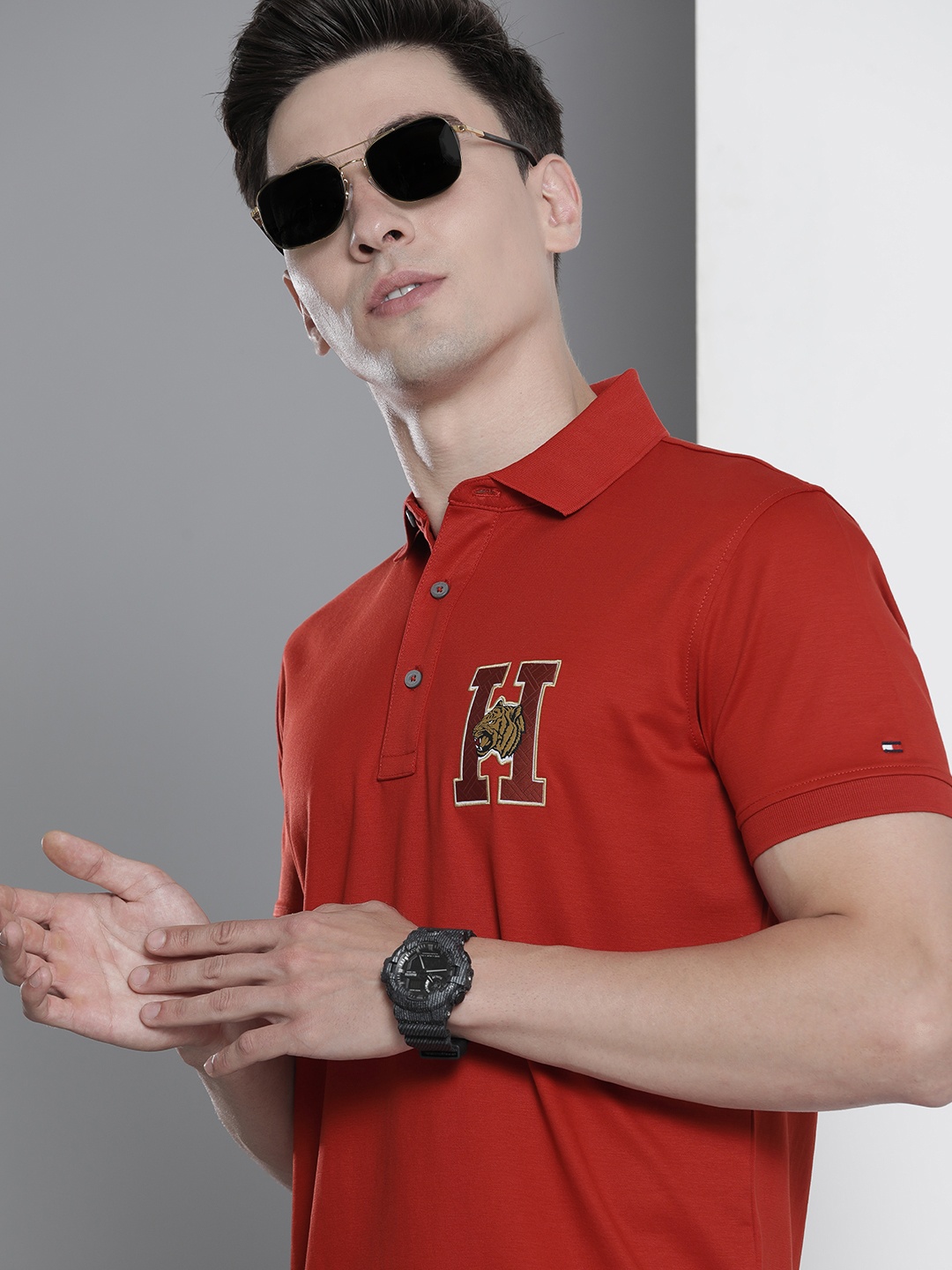 

Tommy Hilfiger Men Red Solid Polo Collar Regular Sleeves Applique Slim Fit T-shirt