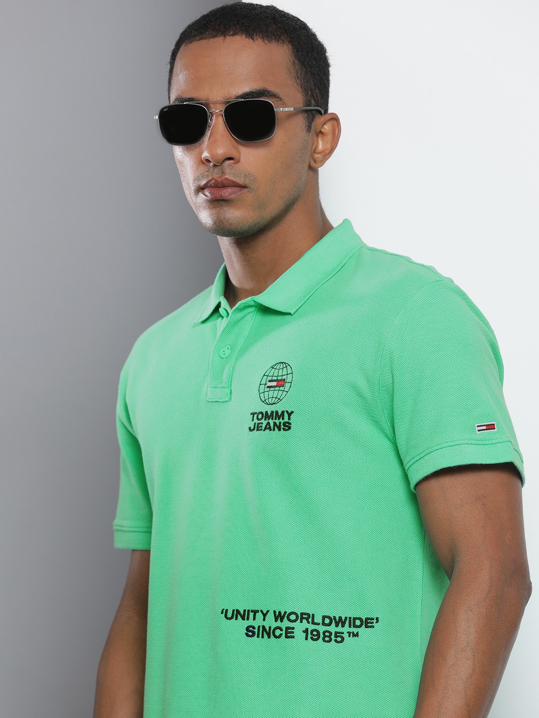 

Tommy Hilfiger Men Green Self Design Polo Collar Organic Cotton T-shirt