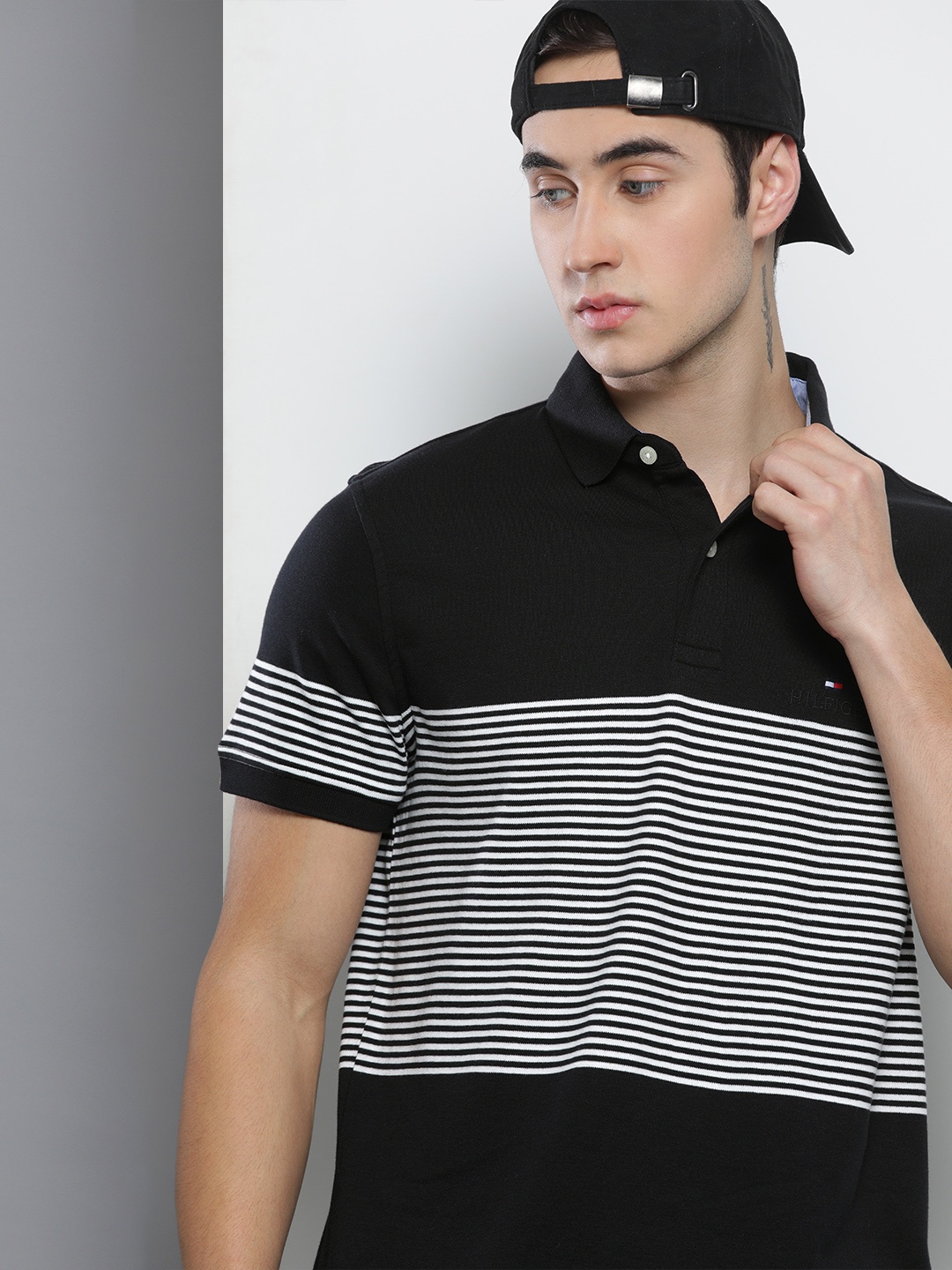 

Tommy Hilfiger Men Black & White Striped Polo Collar T-shirt