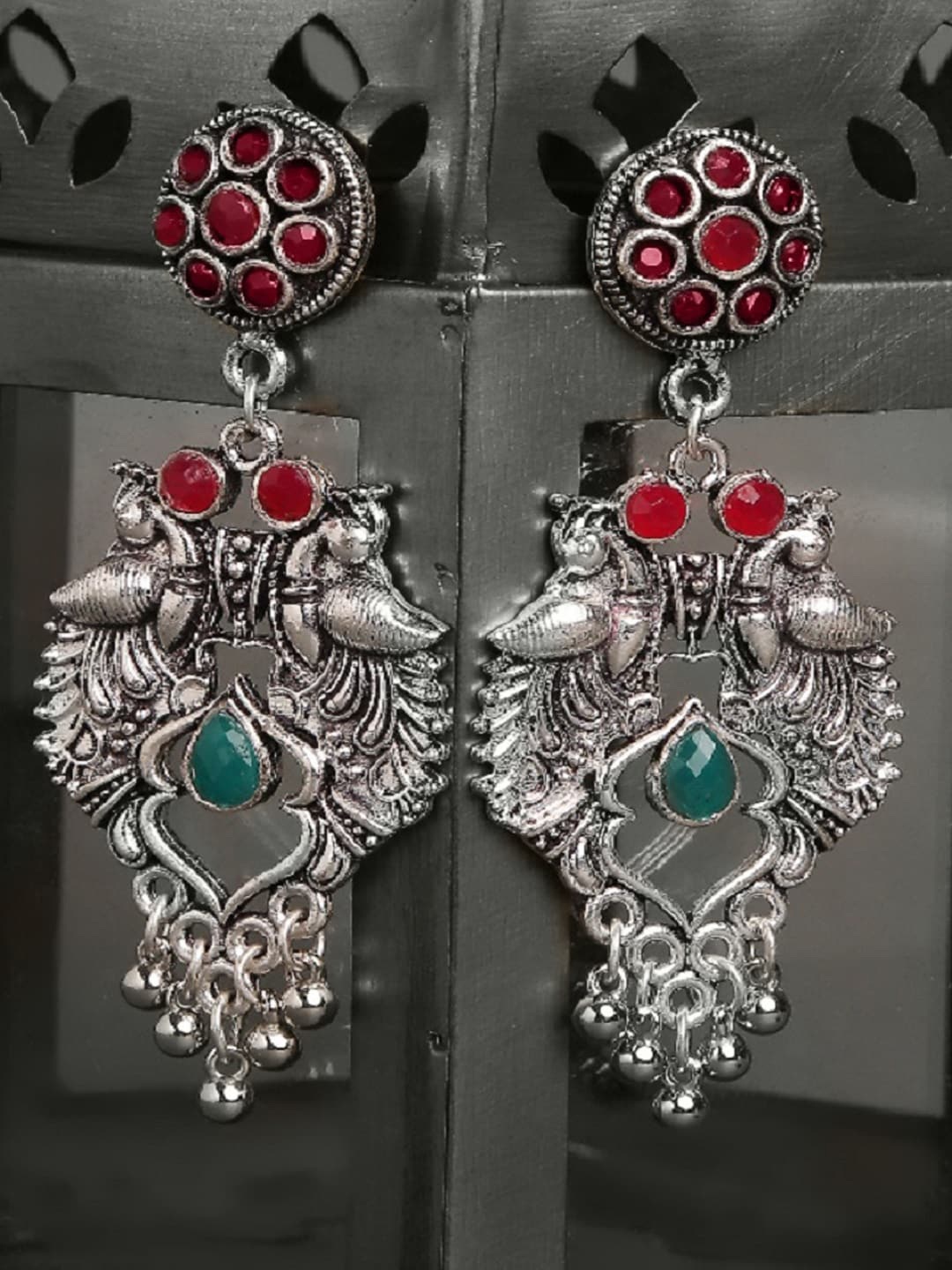 

OOMPH Silver-Toned Oxidised Peacock Shaped Drop Earrings