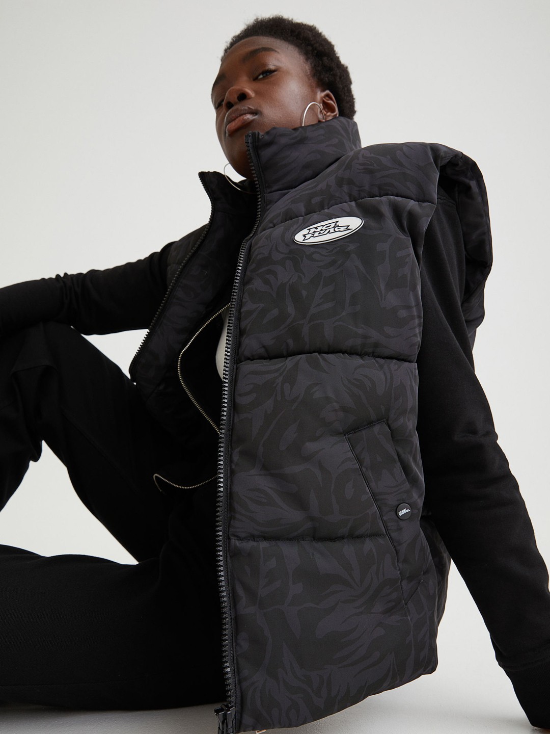 

H&M Women Black Printed Padded Gilet