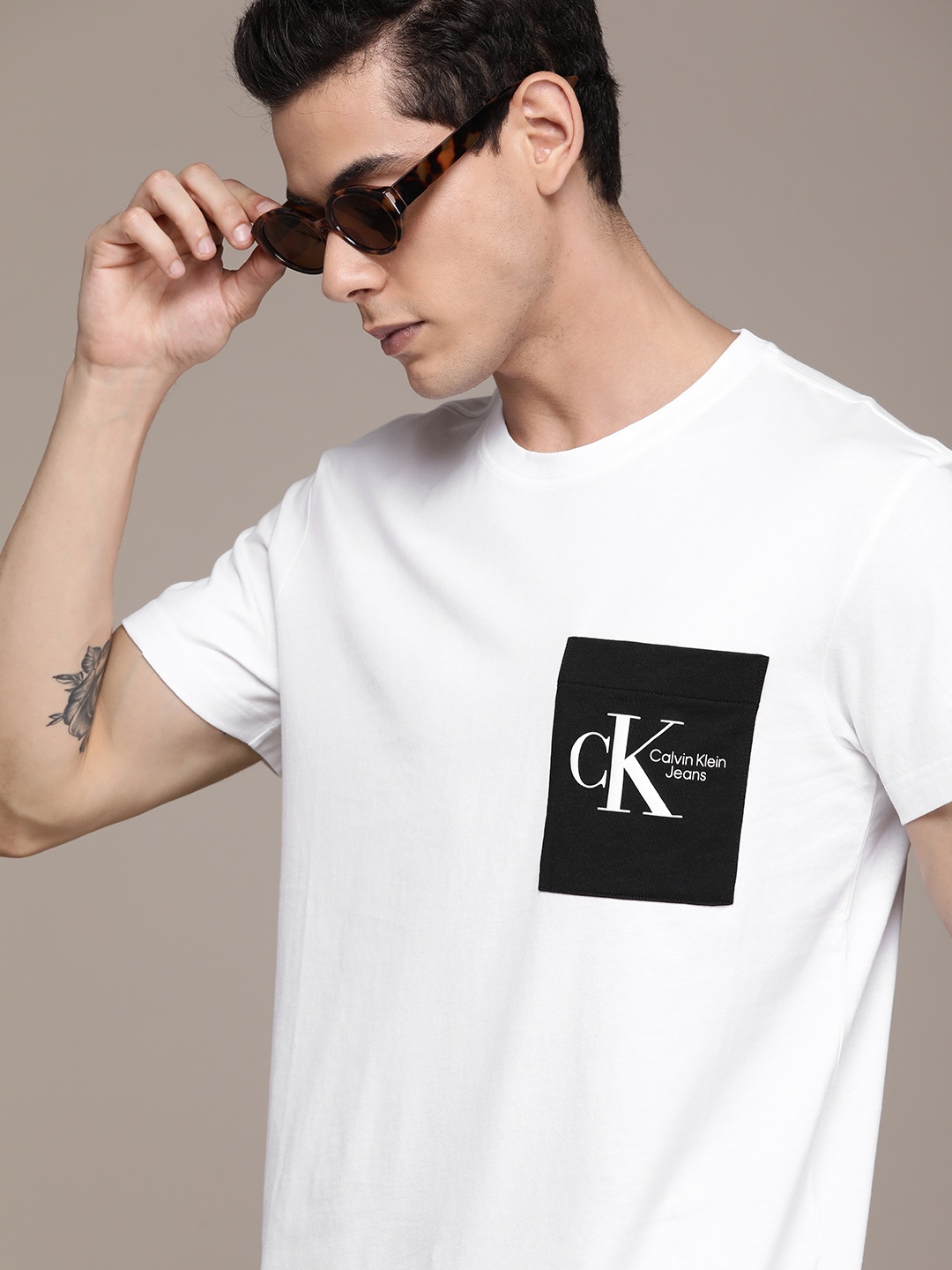 

Calvin Klein Jeans Men White Brand Logo Printed Pocket Detail Pure Cotton T-shirt