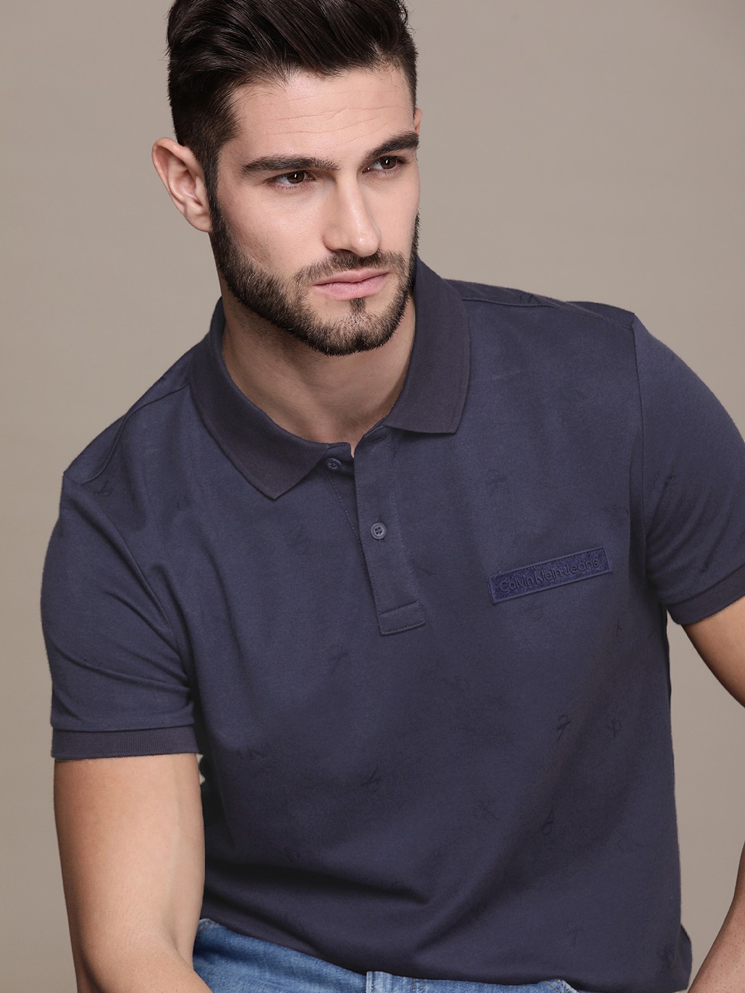 

Calvin Klein Jeans Men Navy Blue Brand Logo Printed Polo Collar T-shirt