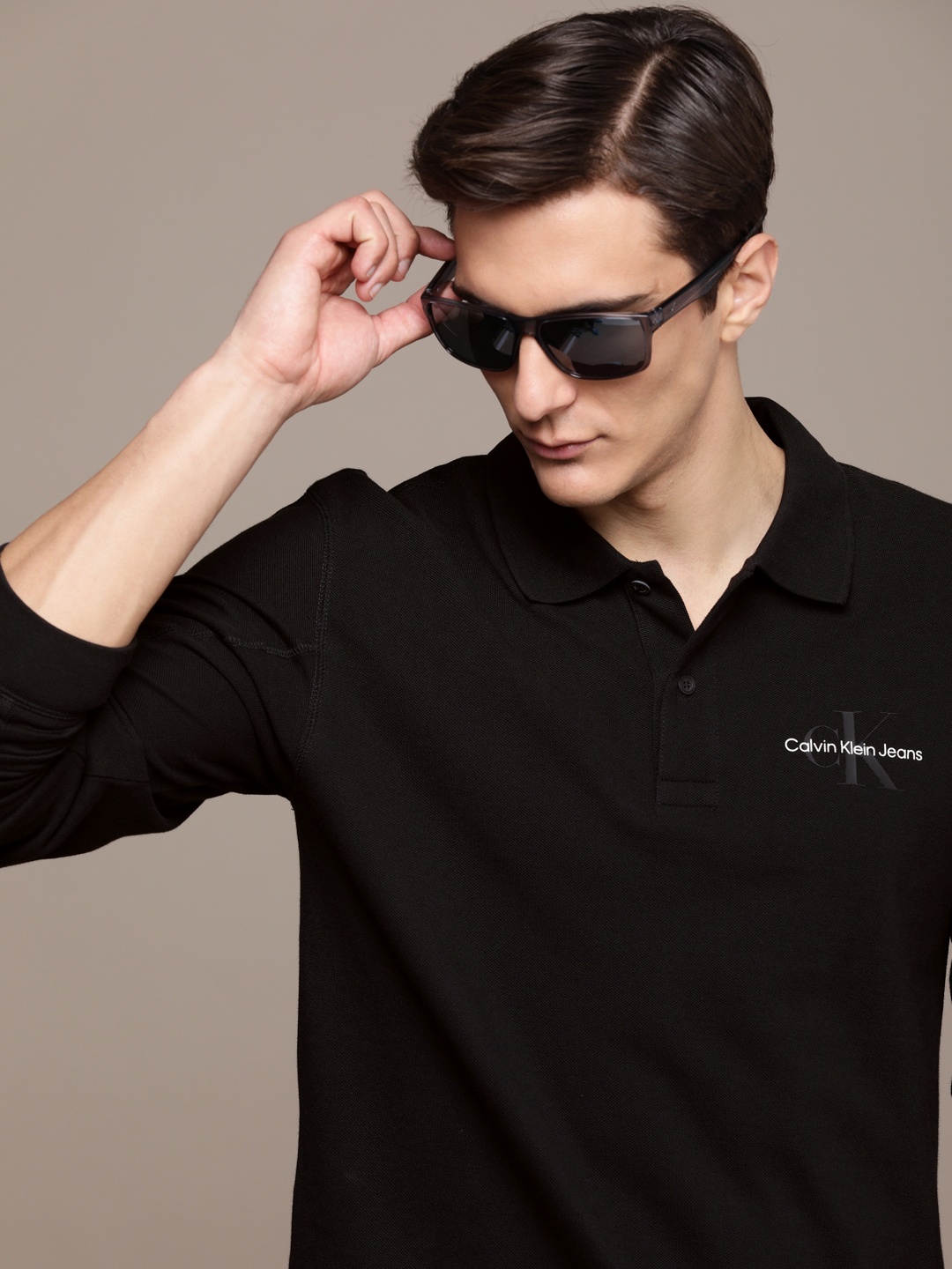 

Calvin Klein Jeans Men Black Solid Pure Cotton Polo Collar T-shirt