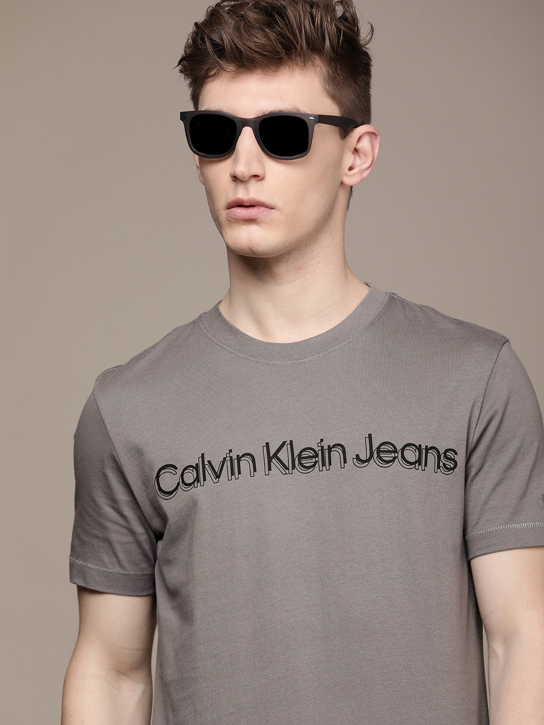 

Calvin Klein Jeans Men Dark Grey Typography Printed Pure Cotton Slim Fit T-shirt