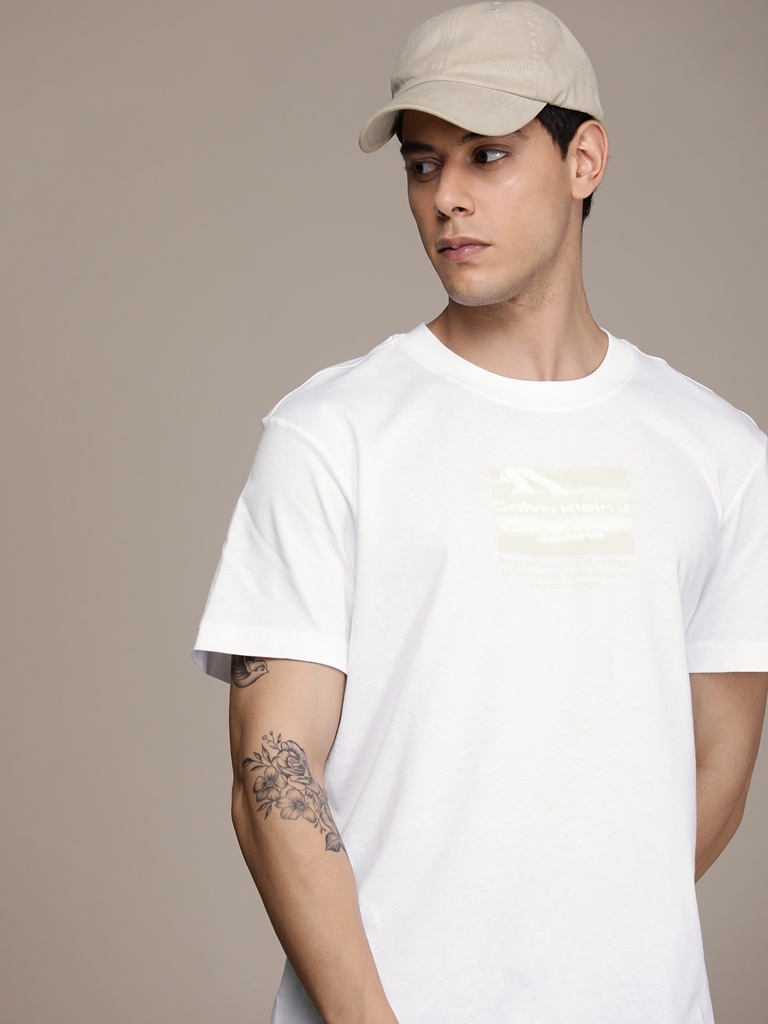 

Calvin Klein Jeans Men White Graphic Printed Casual T-shirt
