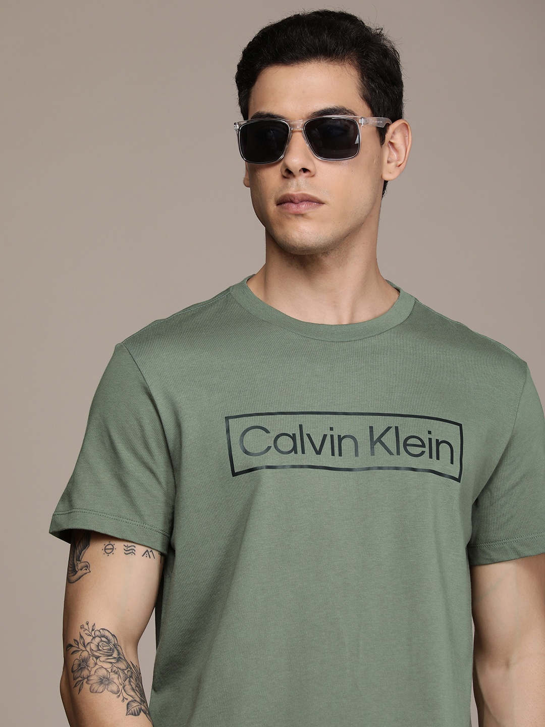 

Calvin Klein Jeans Men Olive Green & Black Brand Logo Printed Casual T-shirt