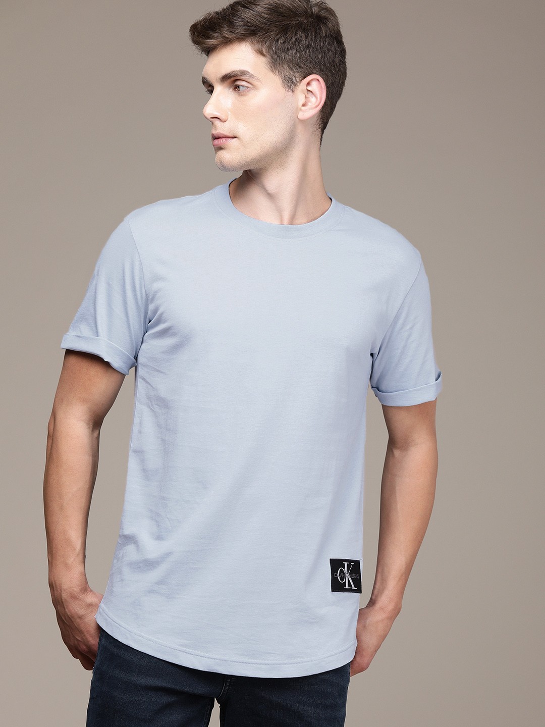 

Calvin Klein Jeans Men Blue Solid Pure Cotton T-shirt with Logo Print
