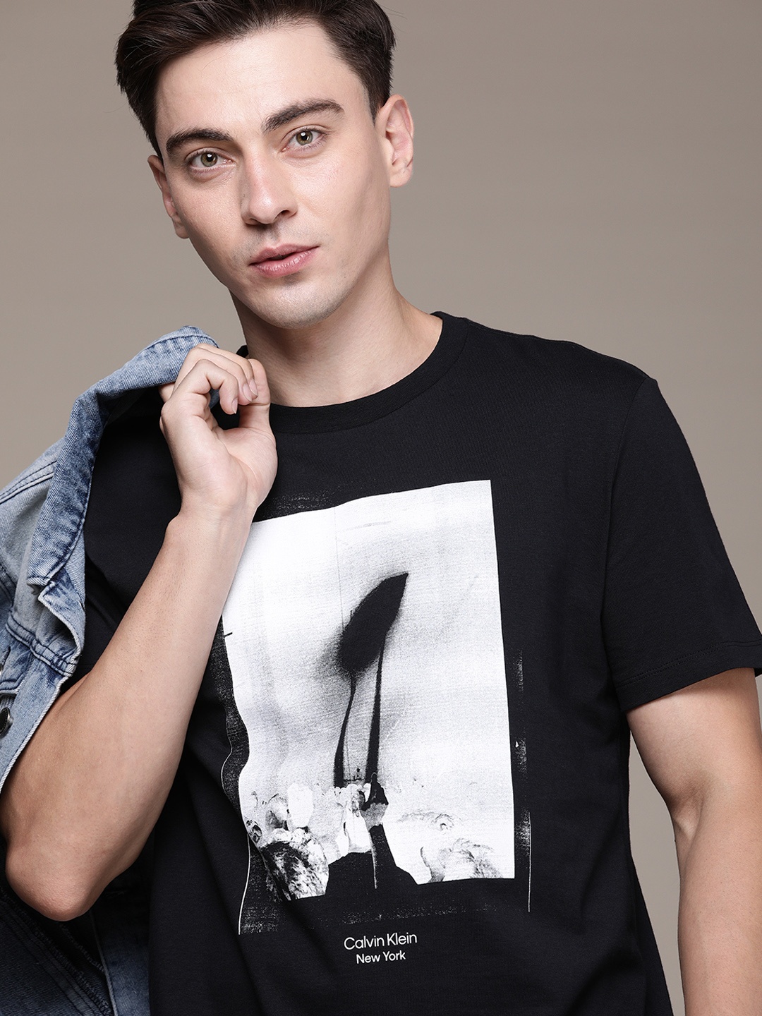 

Calvin Klein Jeans Men Black Graphic Printed Casual T-shirt