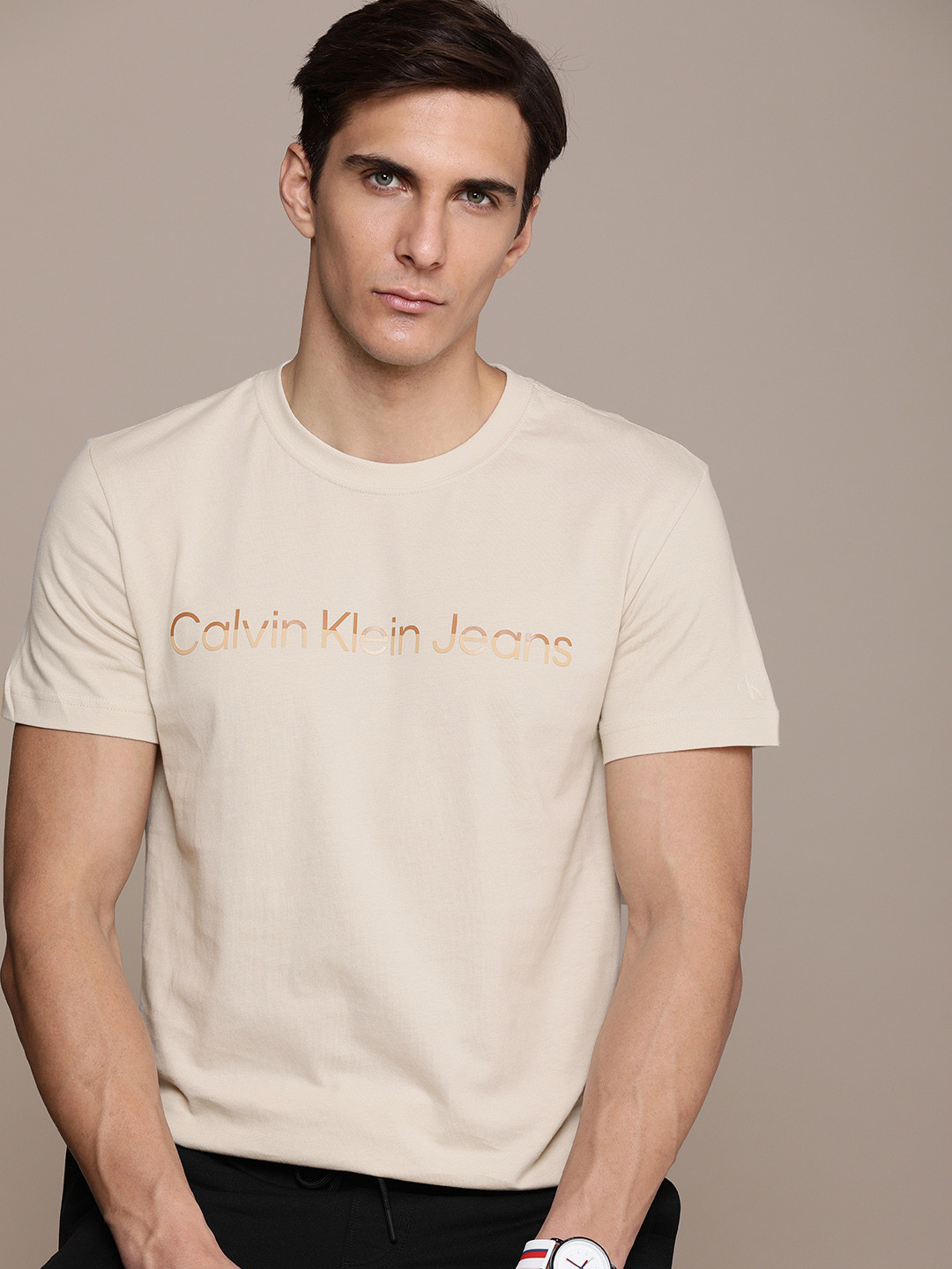 

Calvin Klein Jeans Men Beige Brand Logo Printed Pure Cotton T-shirt