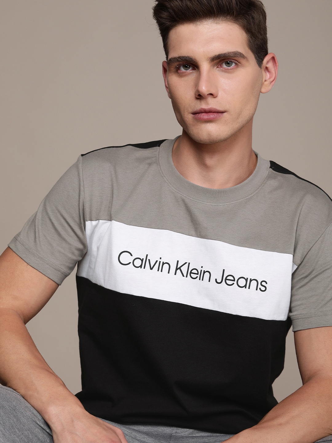

Calvin Klein Jeans Men Black & Grey Colourblocked Pure Cotton T-shirt with Brand Logo