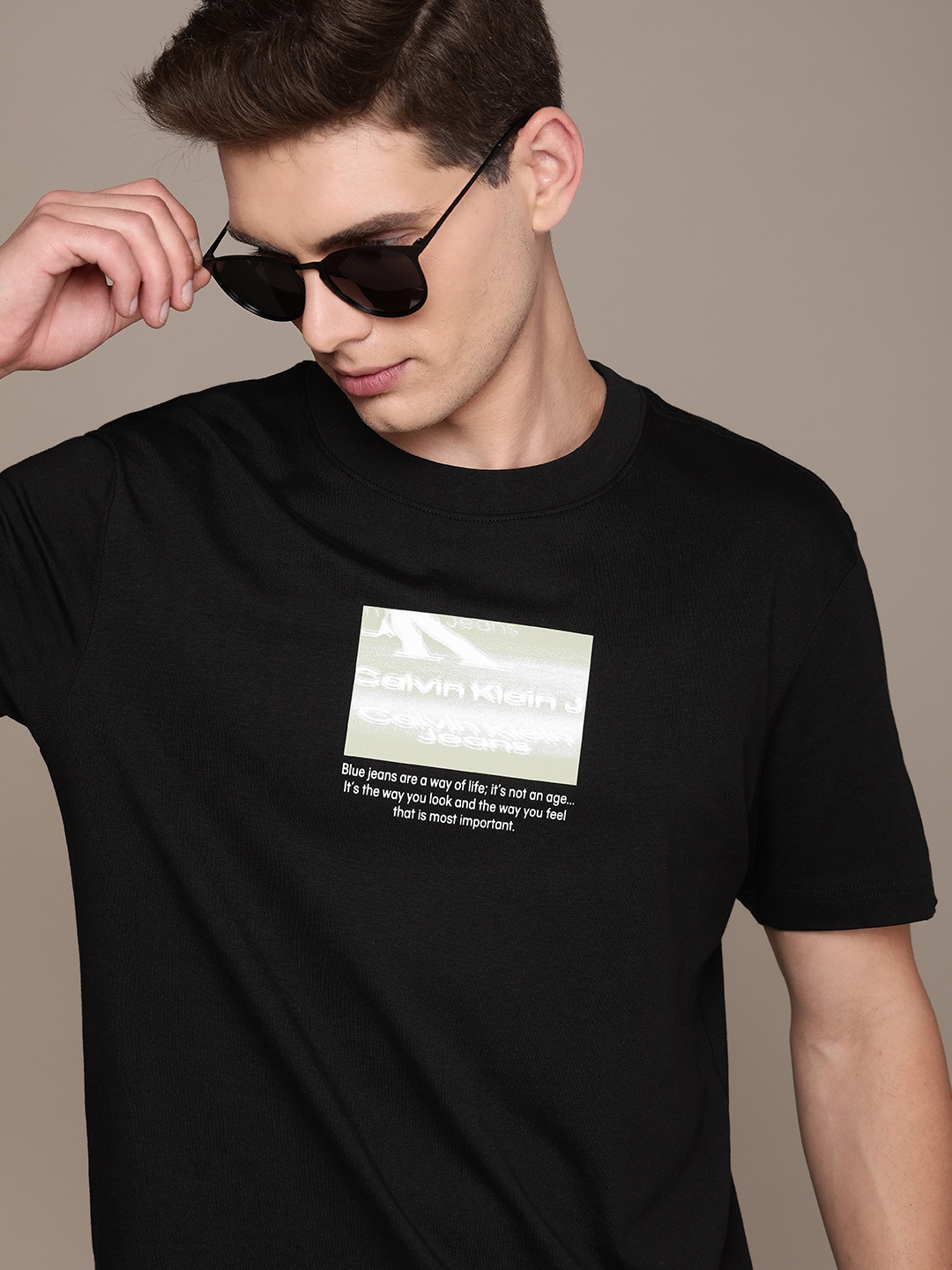 

Calvin Klein Jeans Men Black Typography Print Round Neck Pure Cotton T-shirt