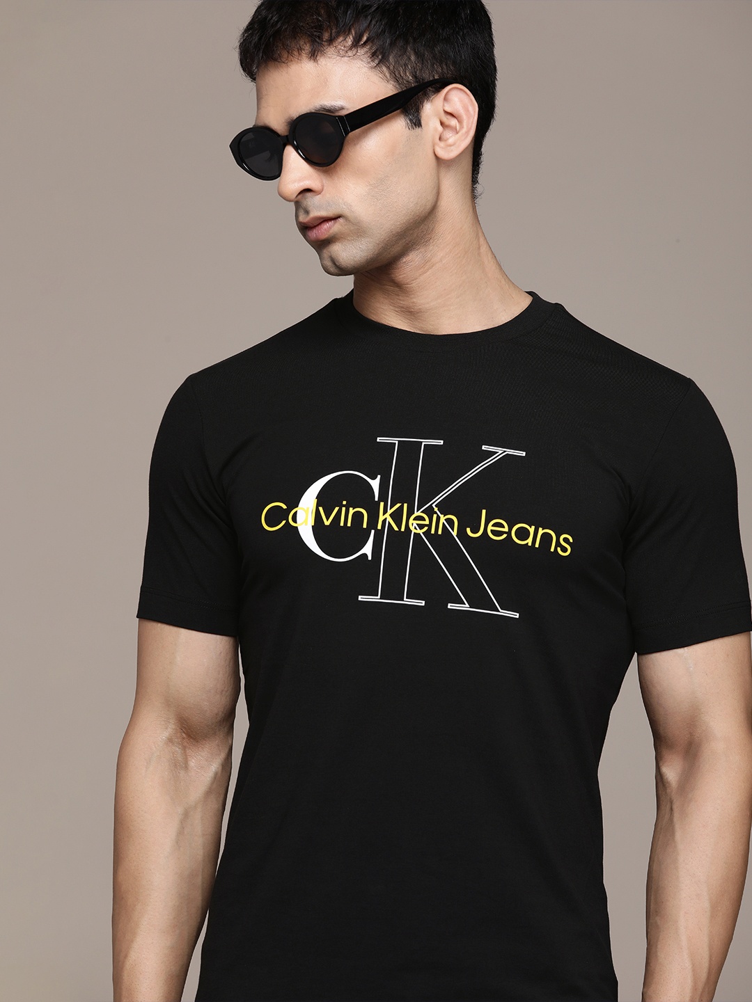 

Calvin Klein Jeans Men Black & White Typography Printed Slim Fit Casual T-shirt