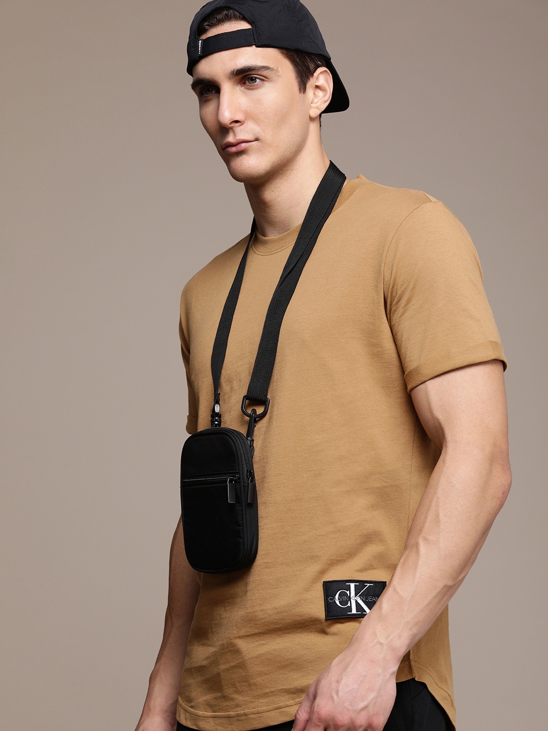 

Calvin Klein Jeans Men Brown Solid Casual T-shirt