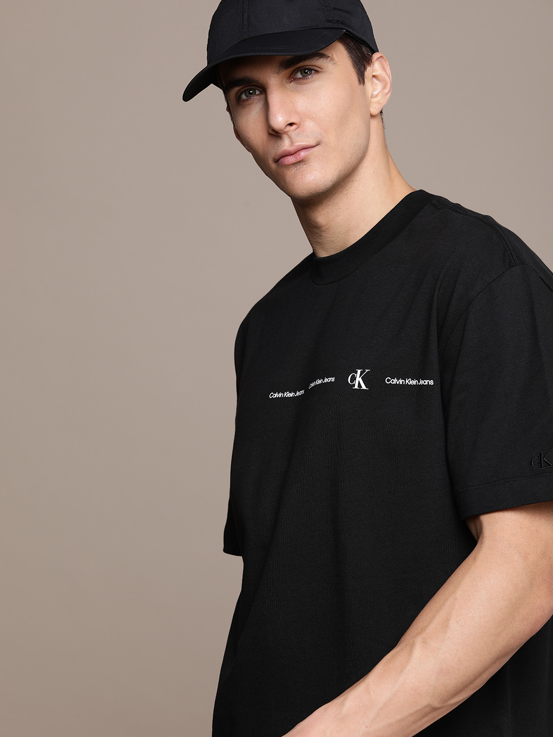 

Calvin Klein Jeans Men Black Typography Printed Slim Fit Casual T-shirt