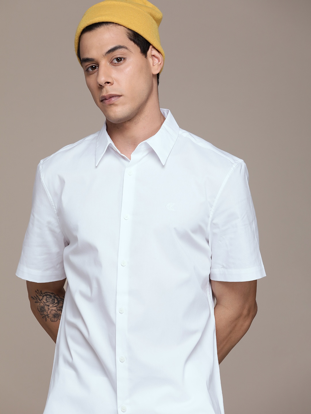 

Calvin Klein Jeans Men White Solid Slim Fit Casual Shirt