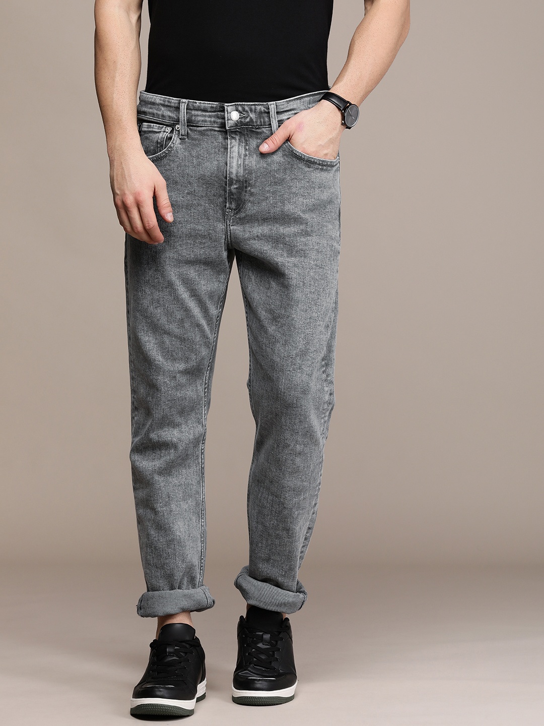 

Calvin Klein Jeans Men Grey Tapered Fit Heavy Fade Stretchable Casual Jeans