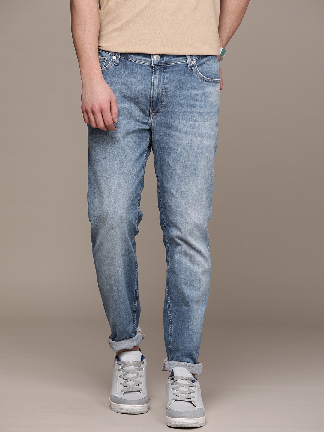 

Calvin Klein Jeans Men Blue Tapered Fit Mid-Rise Heavy Fade Jeans