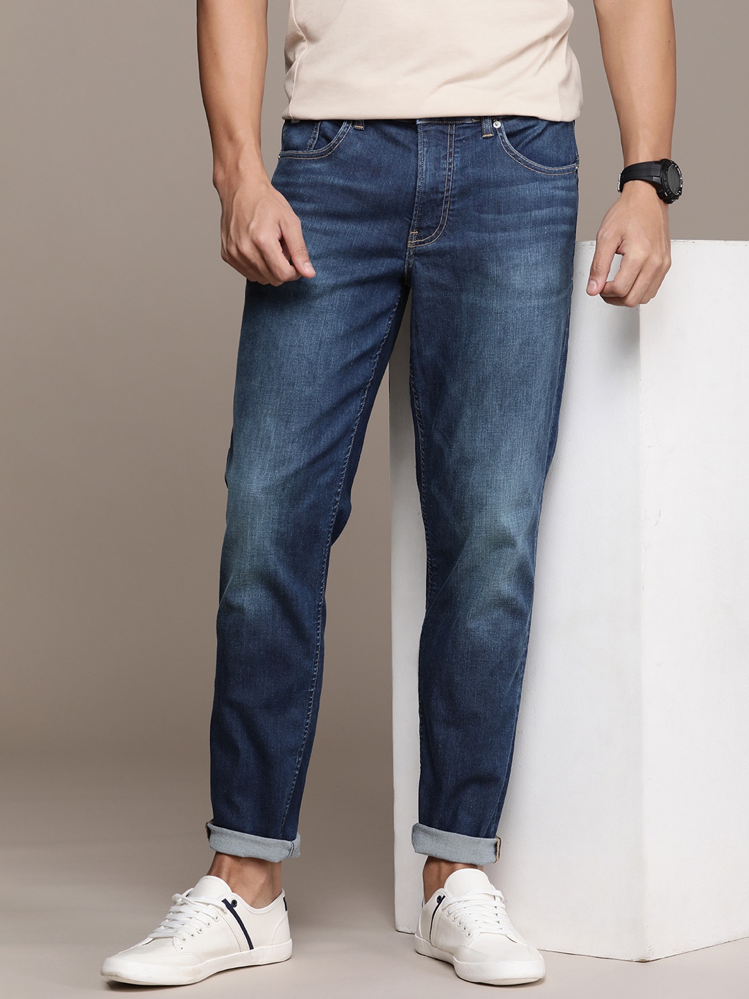 

Calvin Klein Jeans Men Tapered Fit Light Fade Stretchable Jeans, Blue