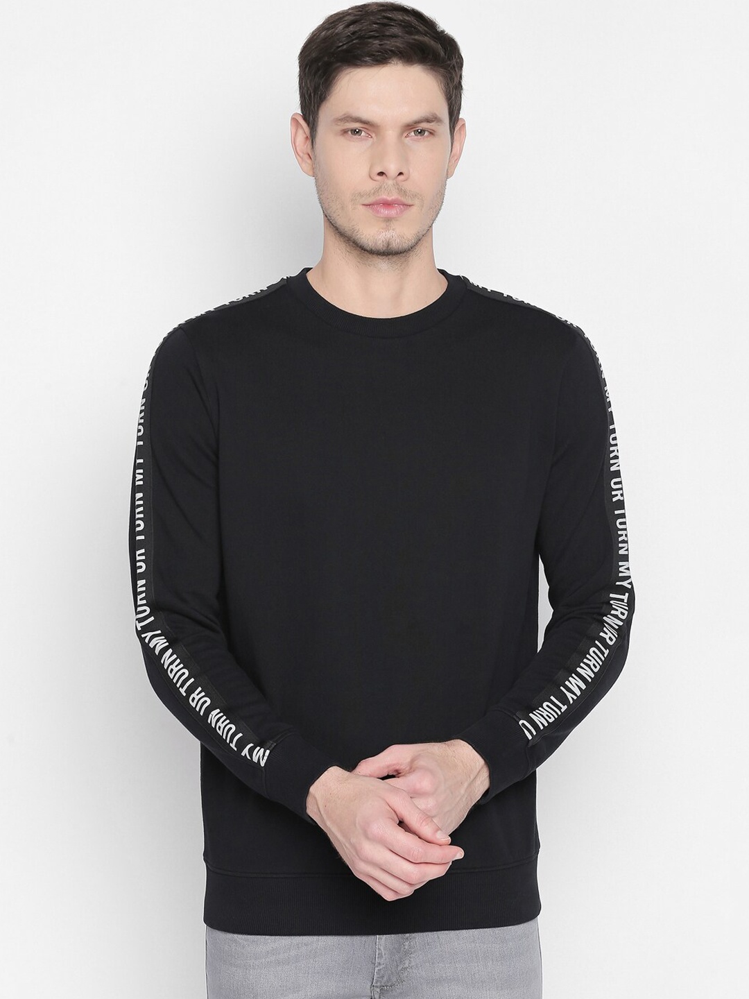 

Basics Men Black Solid Sweatshirt