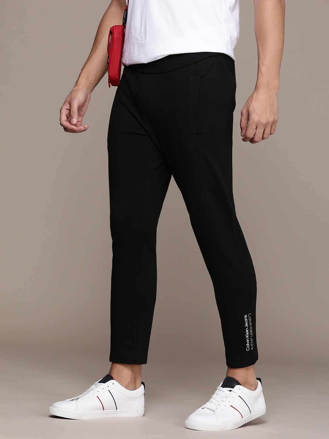 

Calvin Klein Jeans Men Mid Rise Pure Cotton Solid Track Pants, Black
