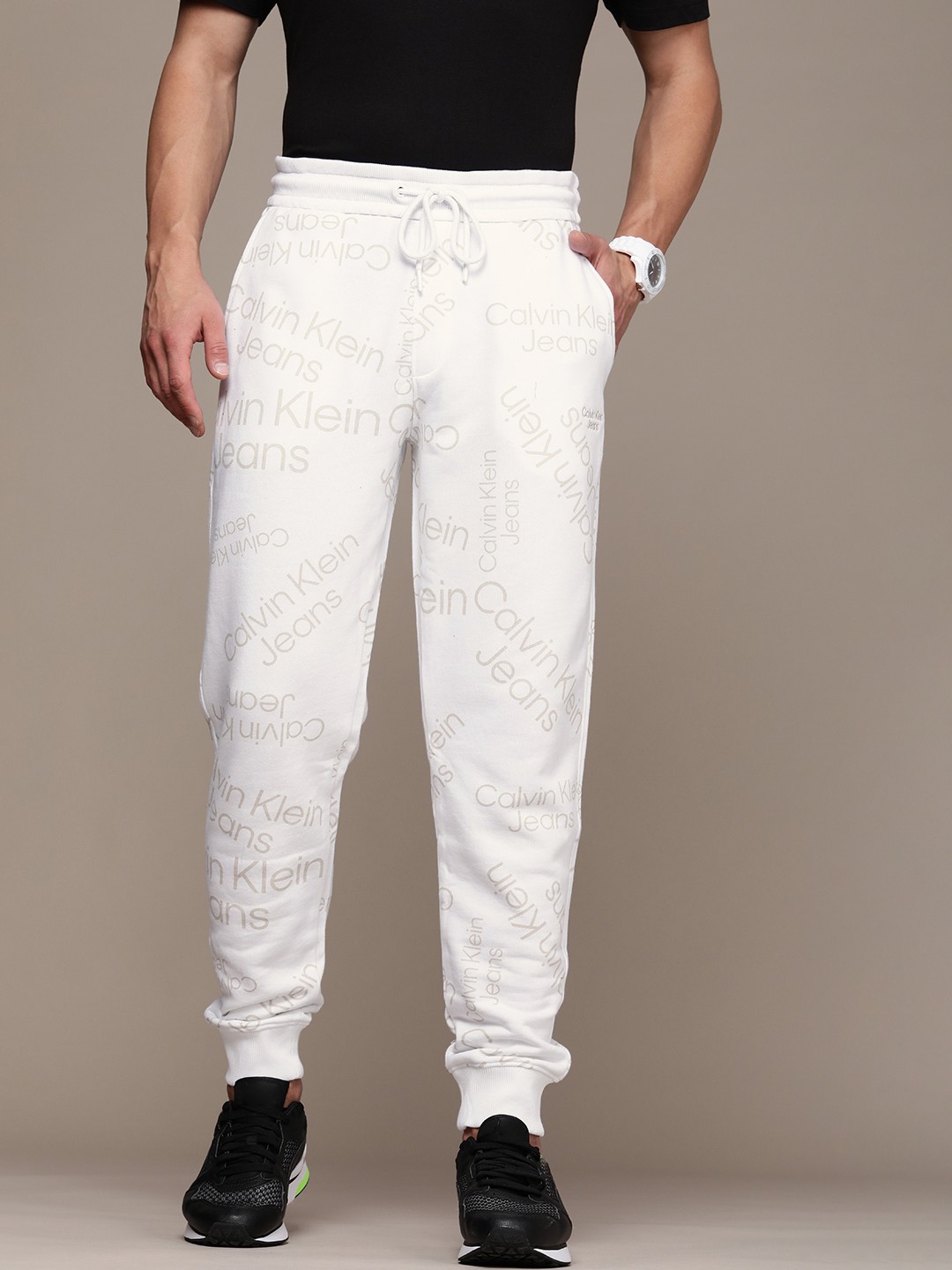 

Calvin Klein Jeans Men White Brand Logo Print Mid-Rise Organic Cotton Joggers
