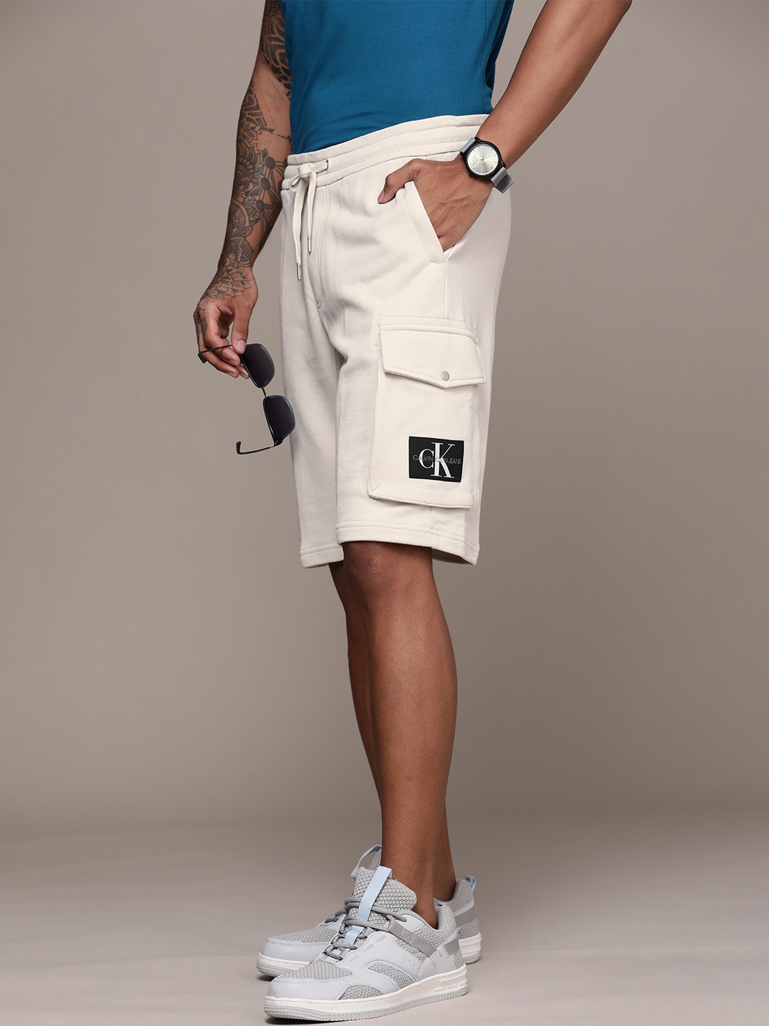 

Calvin Klein Jeans Men Off-White Solid Pure Cotton Regular Shorts