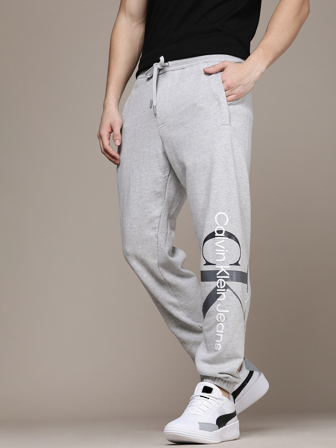 

Calvin Klein Jeans Men Grey Brand Logo Printed Pure Cotton Joggers