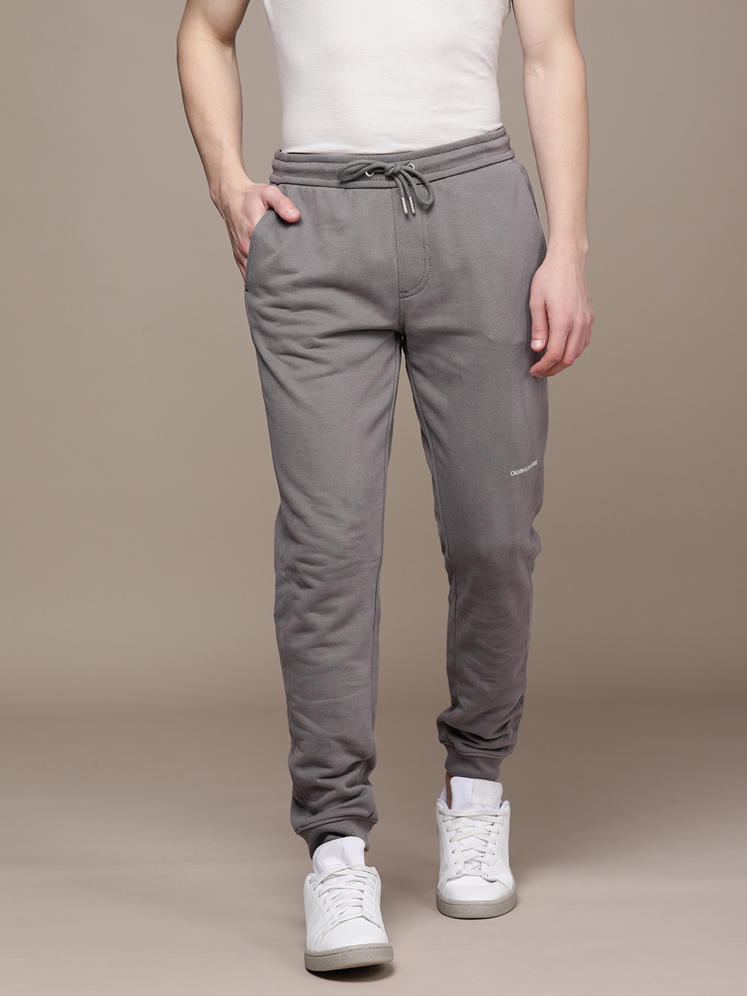 

Calvin Klein Jeans Men Grey Solid Mid-Rise Regular Joggers