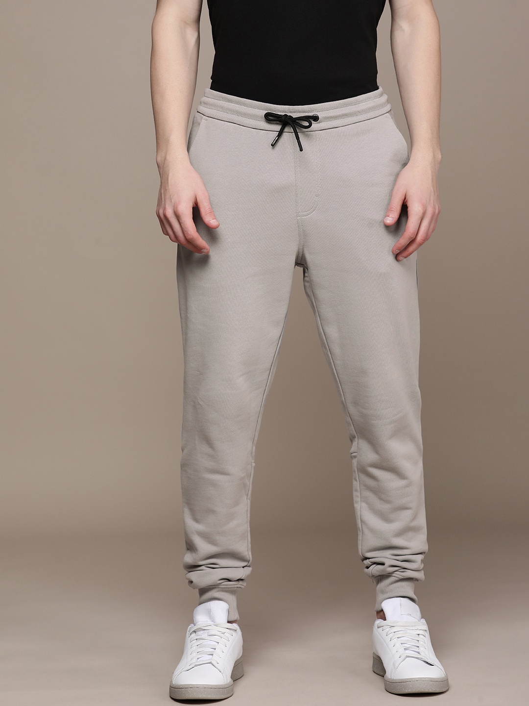 

Calvin Klein Jeans Men Grey Solid Premium Loose Fit Joggers