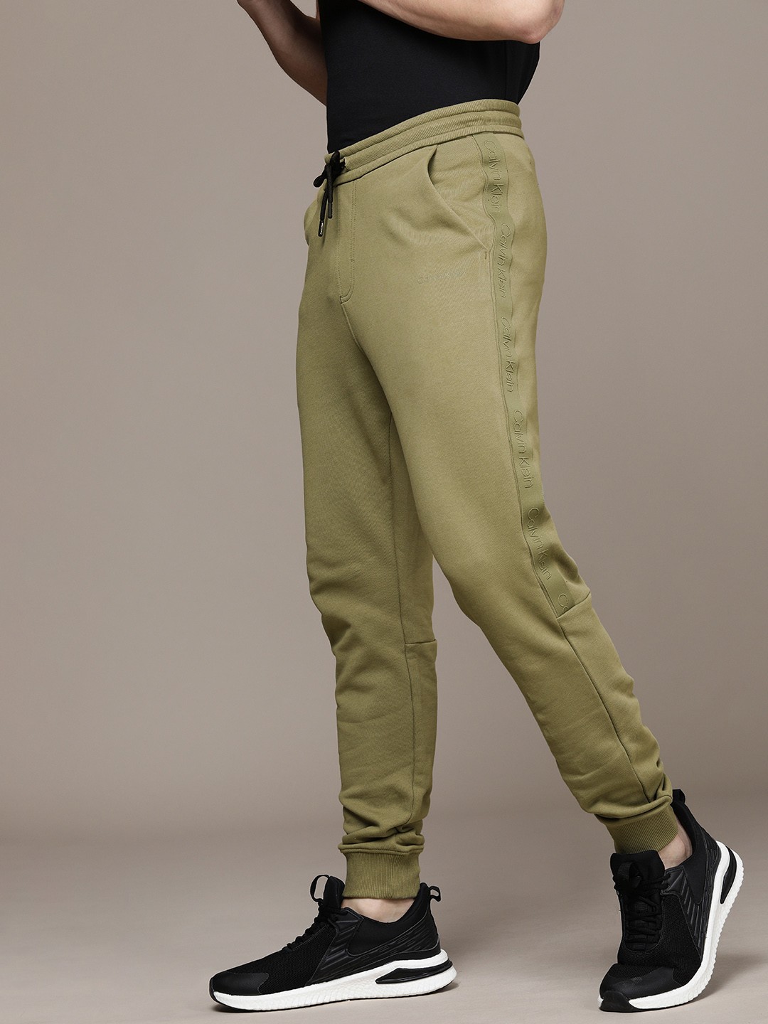 

Calvin Klein Jeans Men Olive Green Solid Pure Cotton Joggers