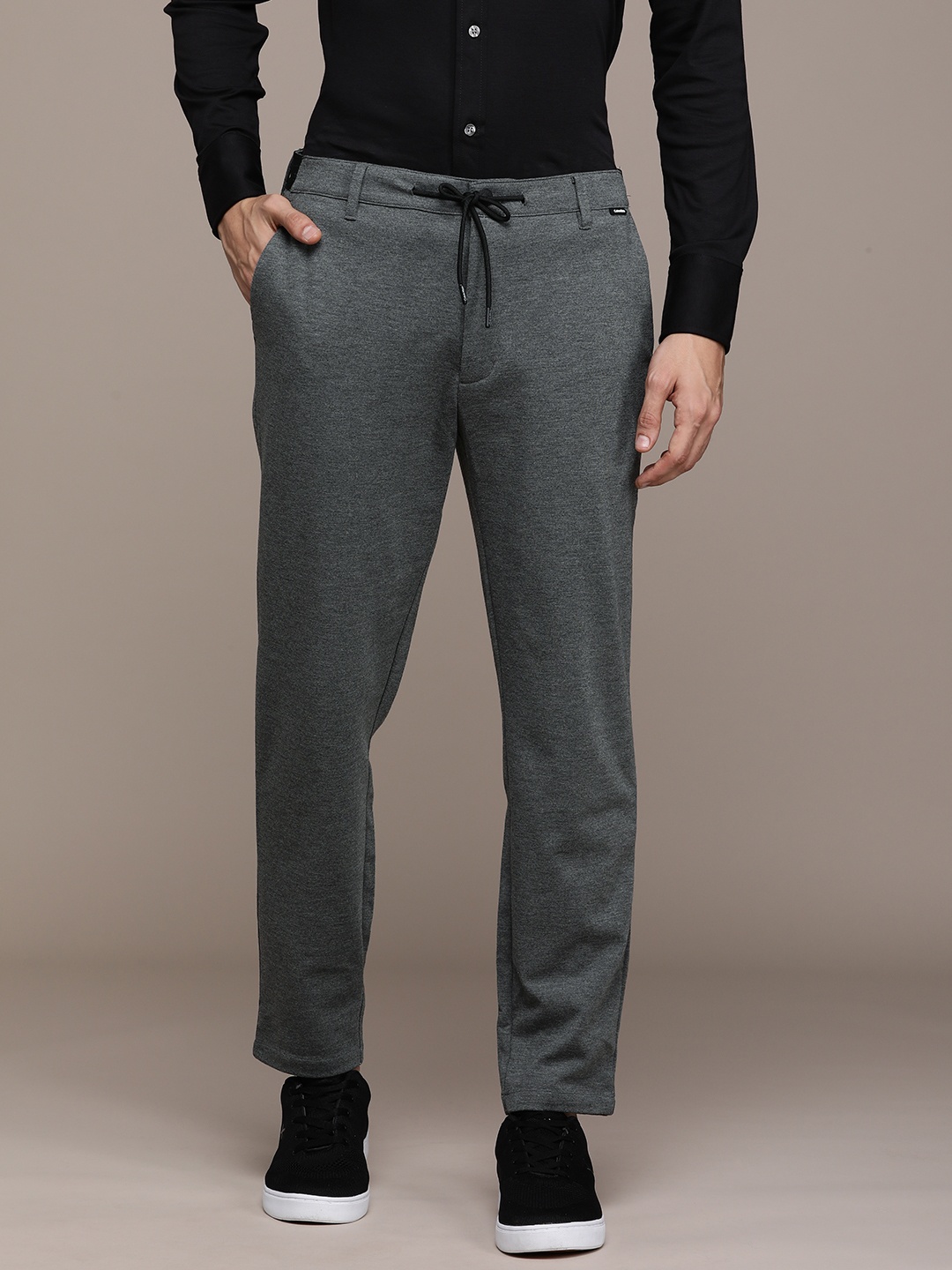 

Calvin Klein Jeans Men Grey Solid Tapered Fit Trousers