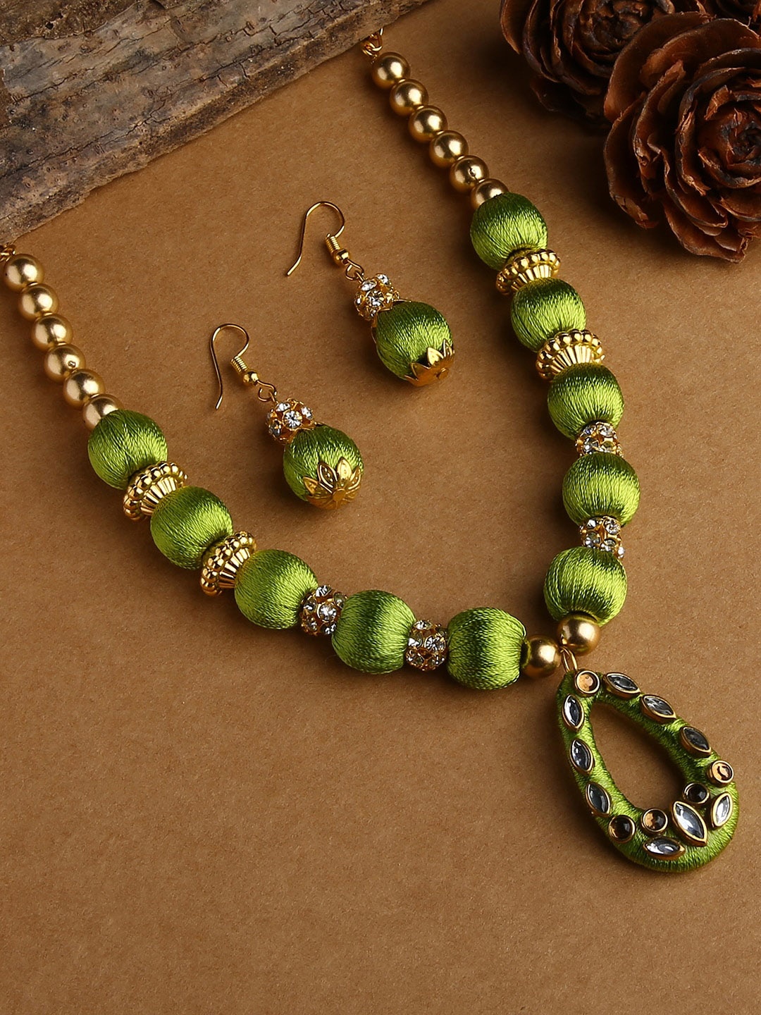 

AKSHARA Gold-Plated White & Green Stone-Studded & Beaded Wooden Balls Silk Thread Jewellery Set