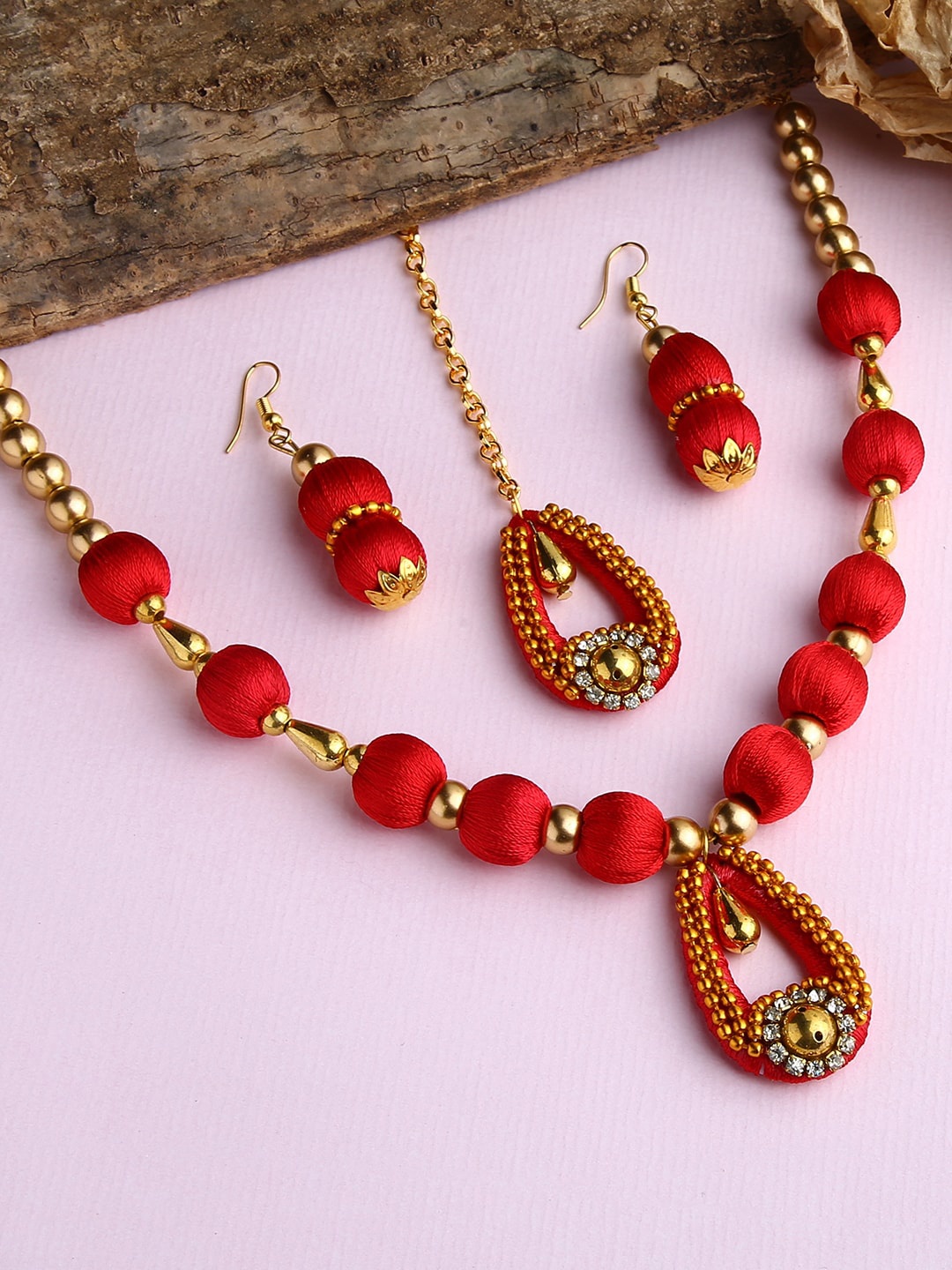 

AKSHARA Gold-Plated White Stone-Studded Red Wooden Balls Silk Thread Jewellery Set