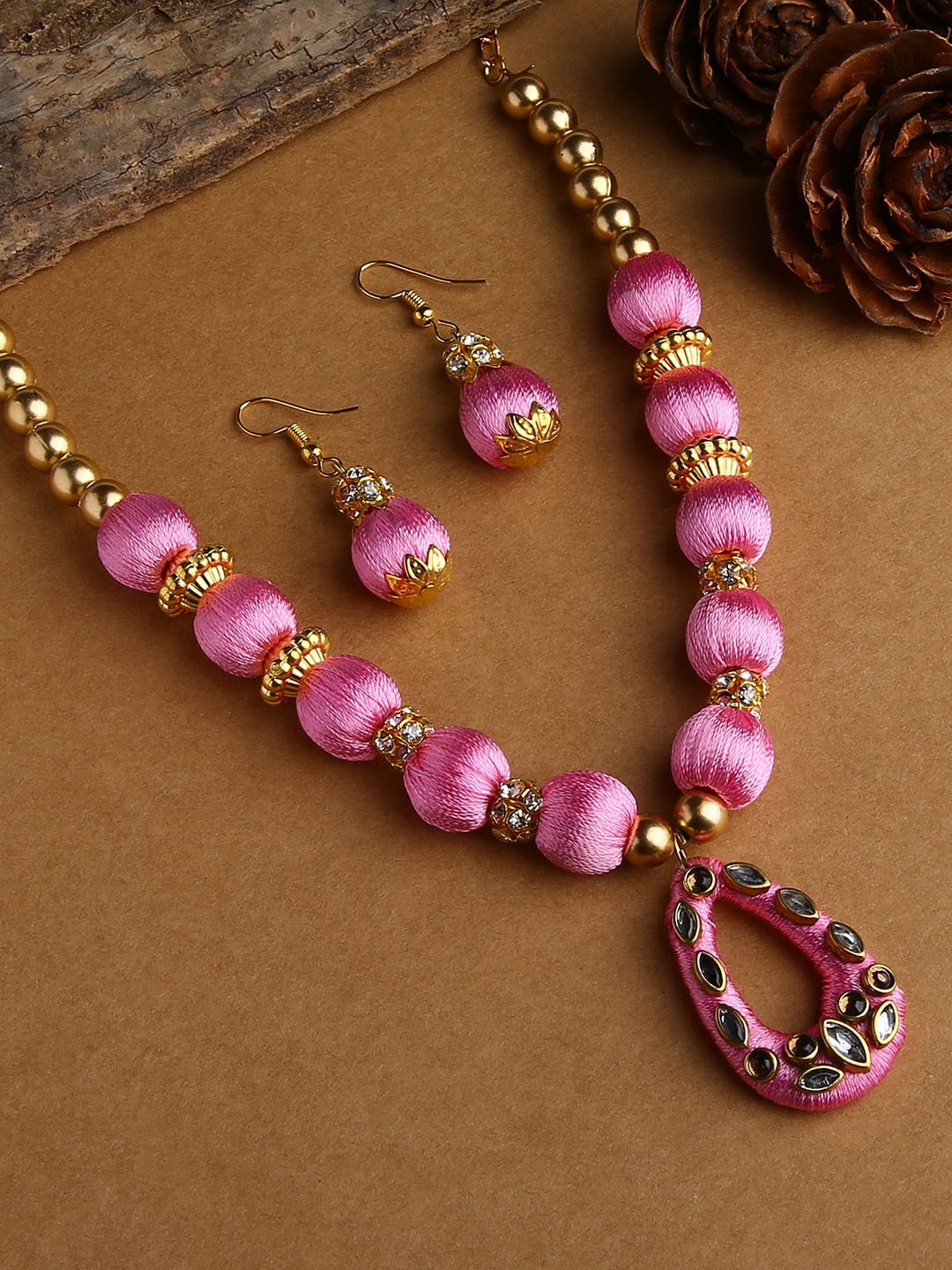 

AKSHARA Gold-Plated White & Rose-Pink Stone-Studded & Beaded Wooden Balls Silk Thread Jewellery Set