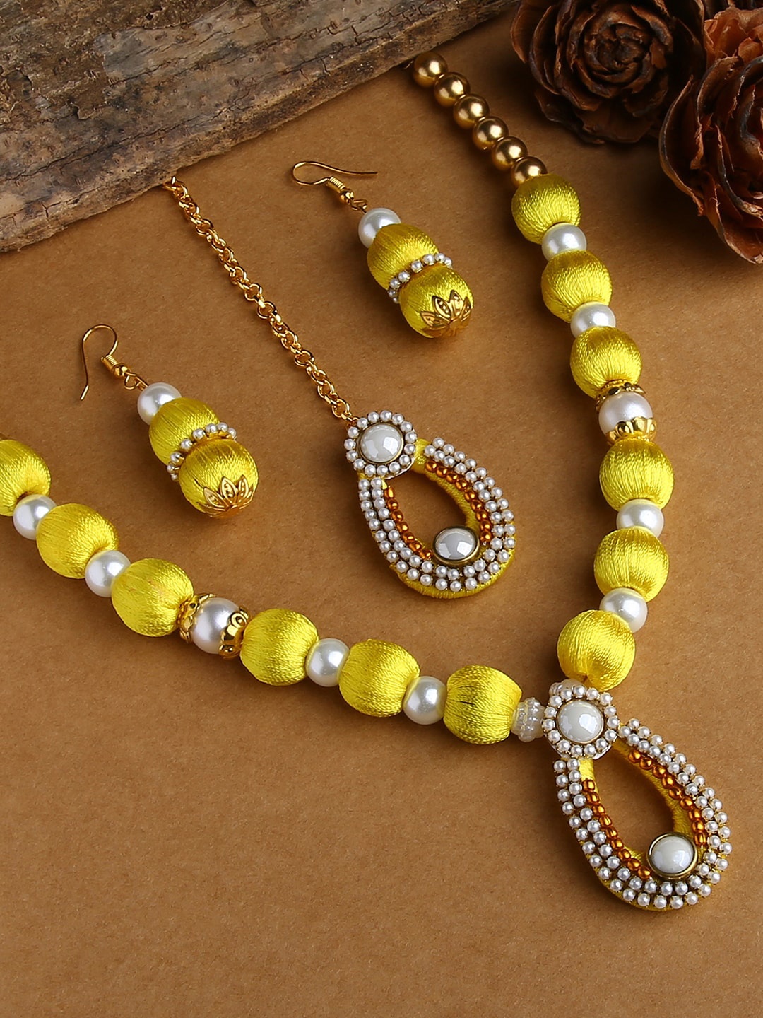 

AKSHARA Gold-Plated White & Yellow Stone-Studded & Beaded Wooden Balls Silk Thread Jewellery Set