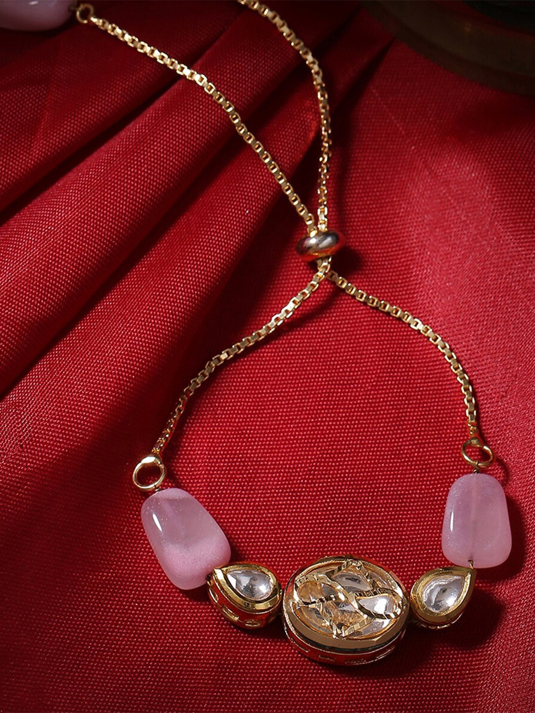 

Shoshaa Women Gold-Toned & Pink Brass Kundan Gold-Plated Charm Bracelet