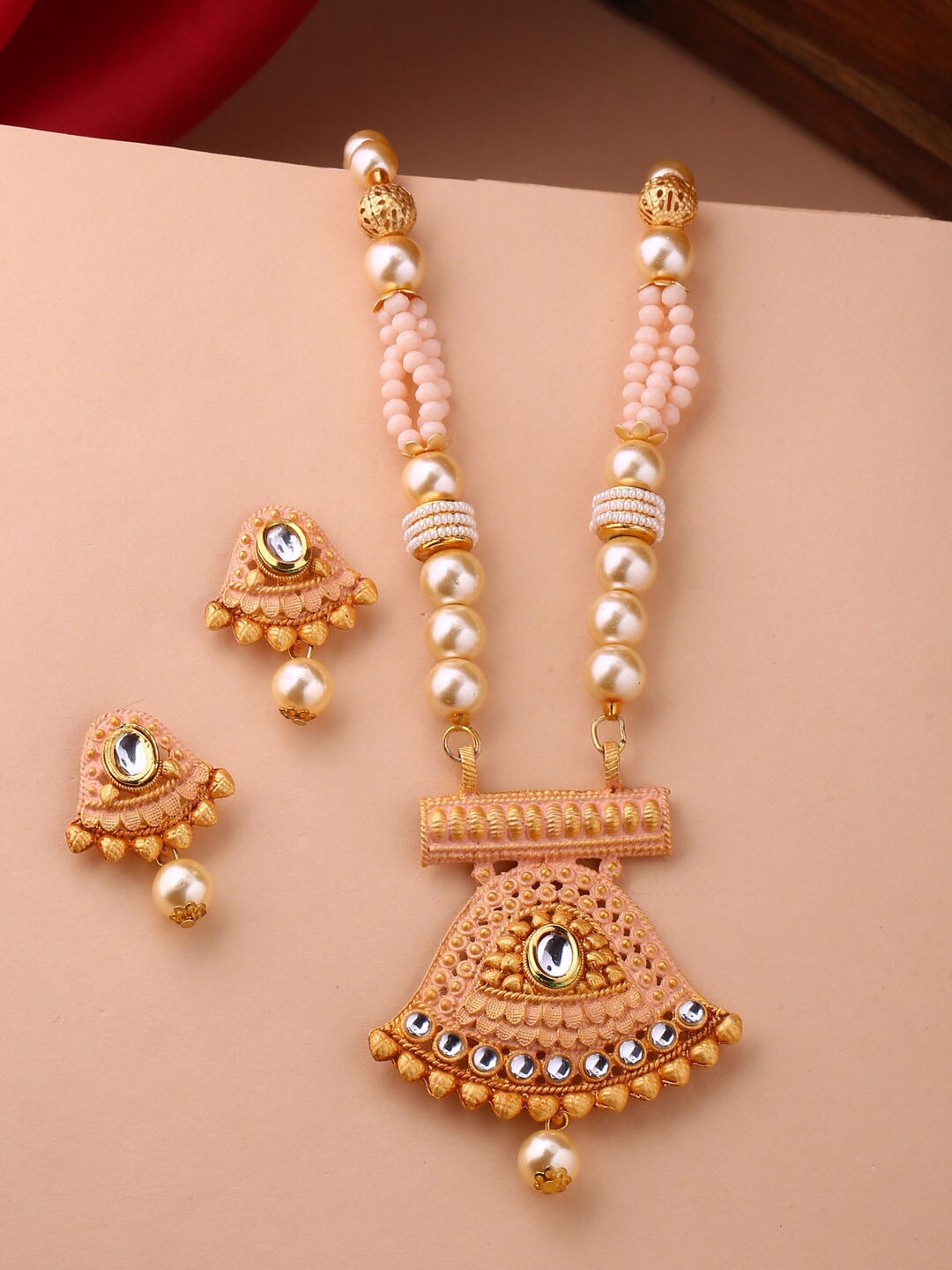 

Shoshaa Gold-Plated White & Peach-Coloured Stone-Studded & Beaded Hand-Painted Jewellery Set