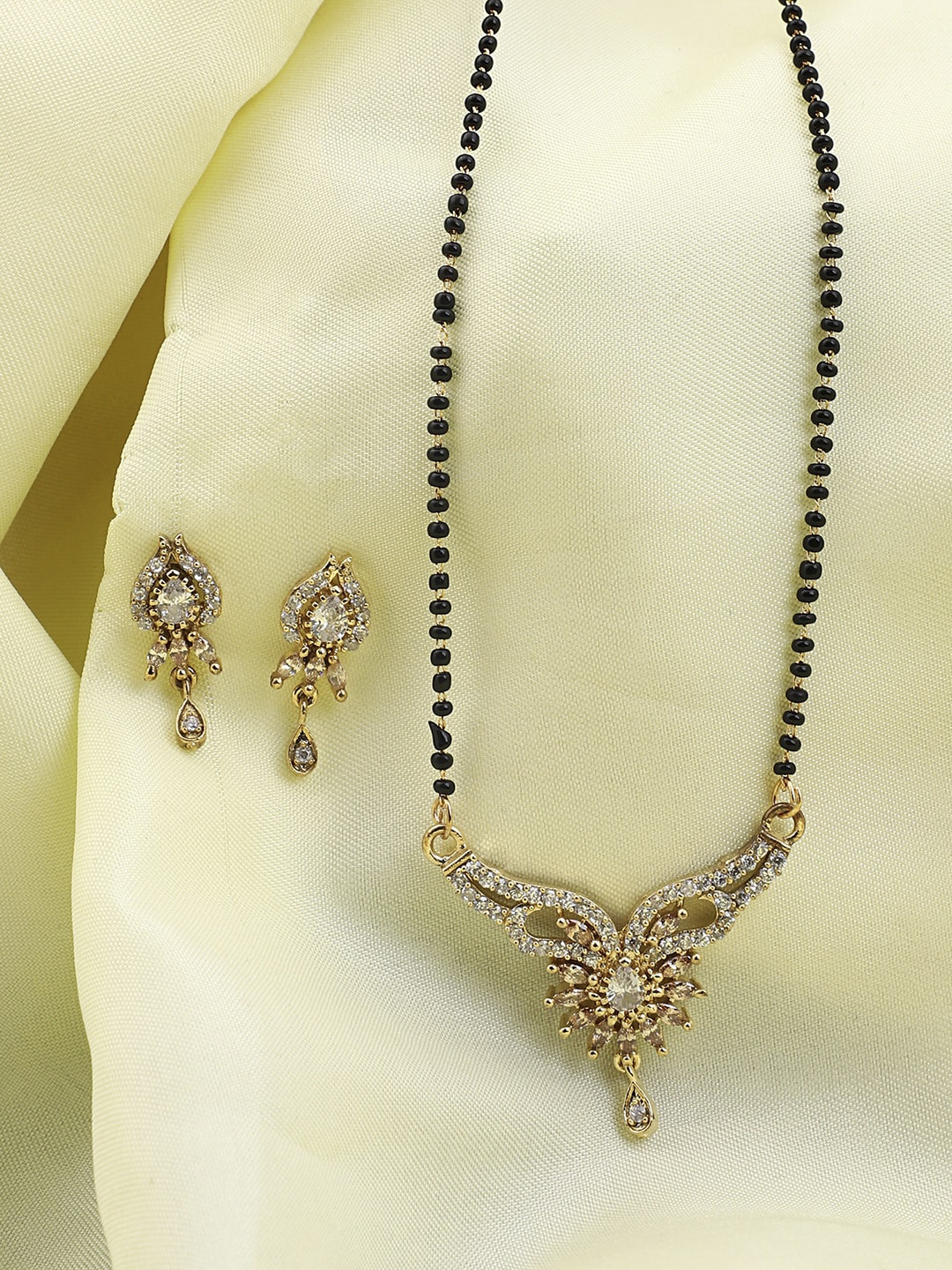 

ANIKAS CREATION Gold-Plated Black Artificial Stone-Studded & Beaded Mangalsutra Set