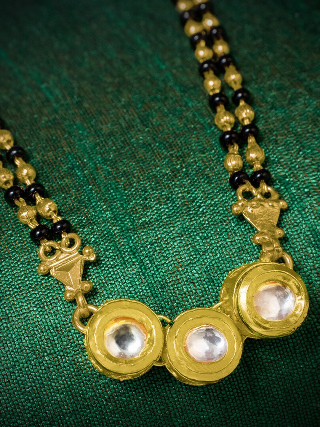 

MORKANTH JEWELLERY Gold-Plated White Stone-Studded & Black Beaded Mangalsutra