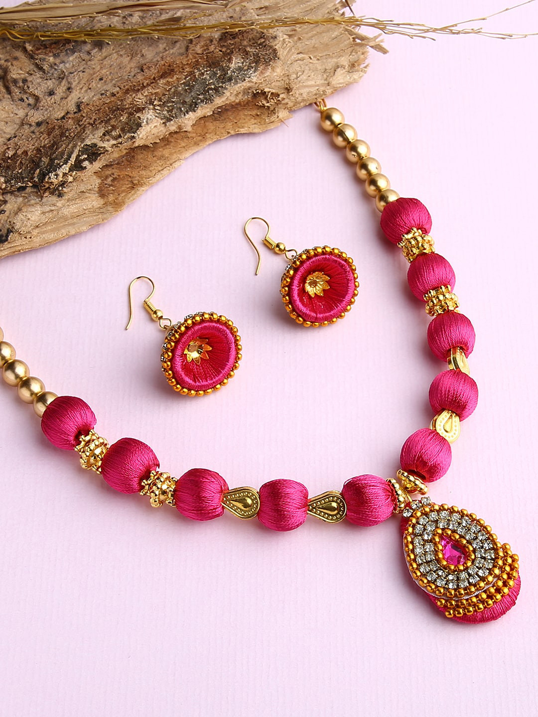 

AKSHARA Gold-Plated & Pink Stones-Studded & Beaded Wooden Balls Silk Thread Jewellery Set